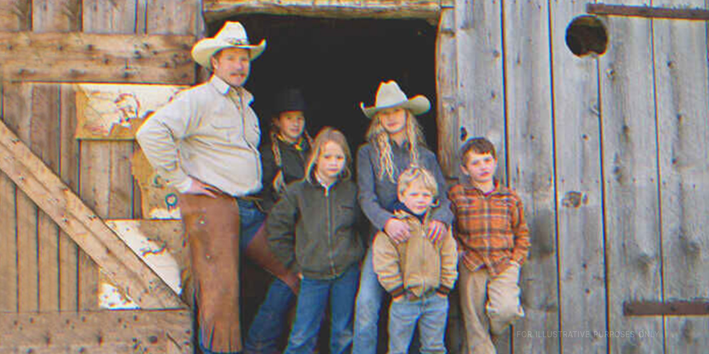 A father posing with his children | Source: Getty Images