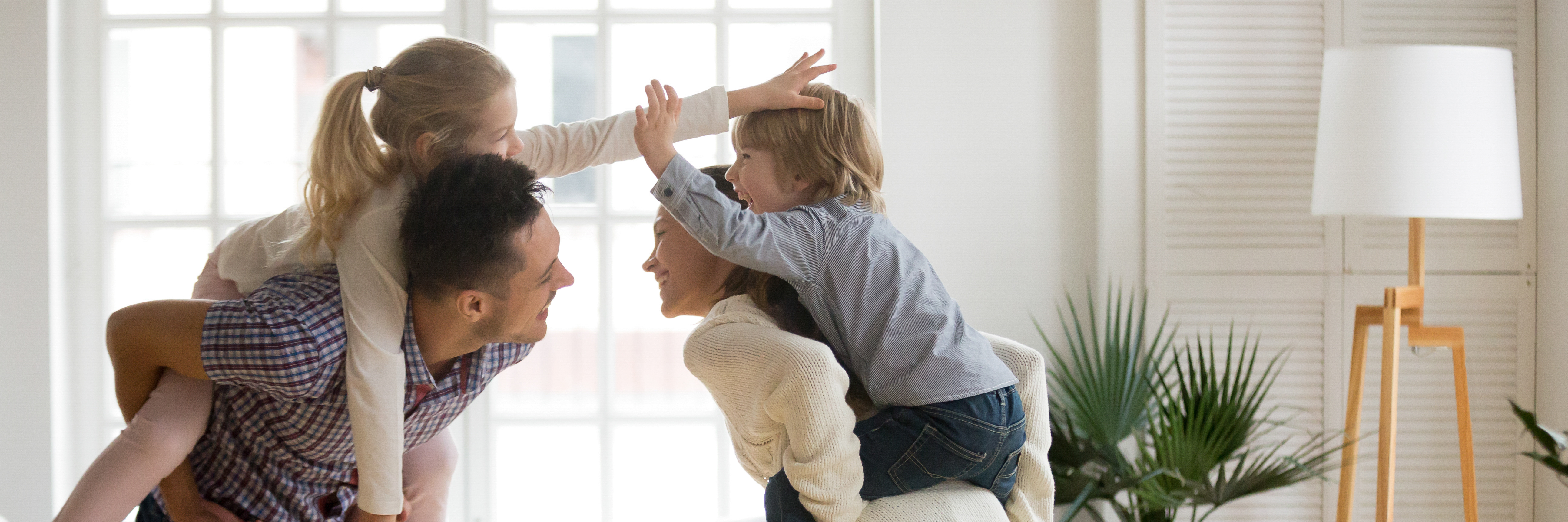 A man is pictured giving his partner a piggyback ride | Source: Shutterstock