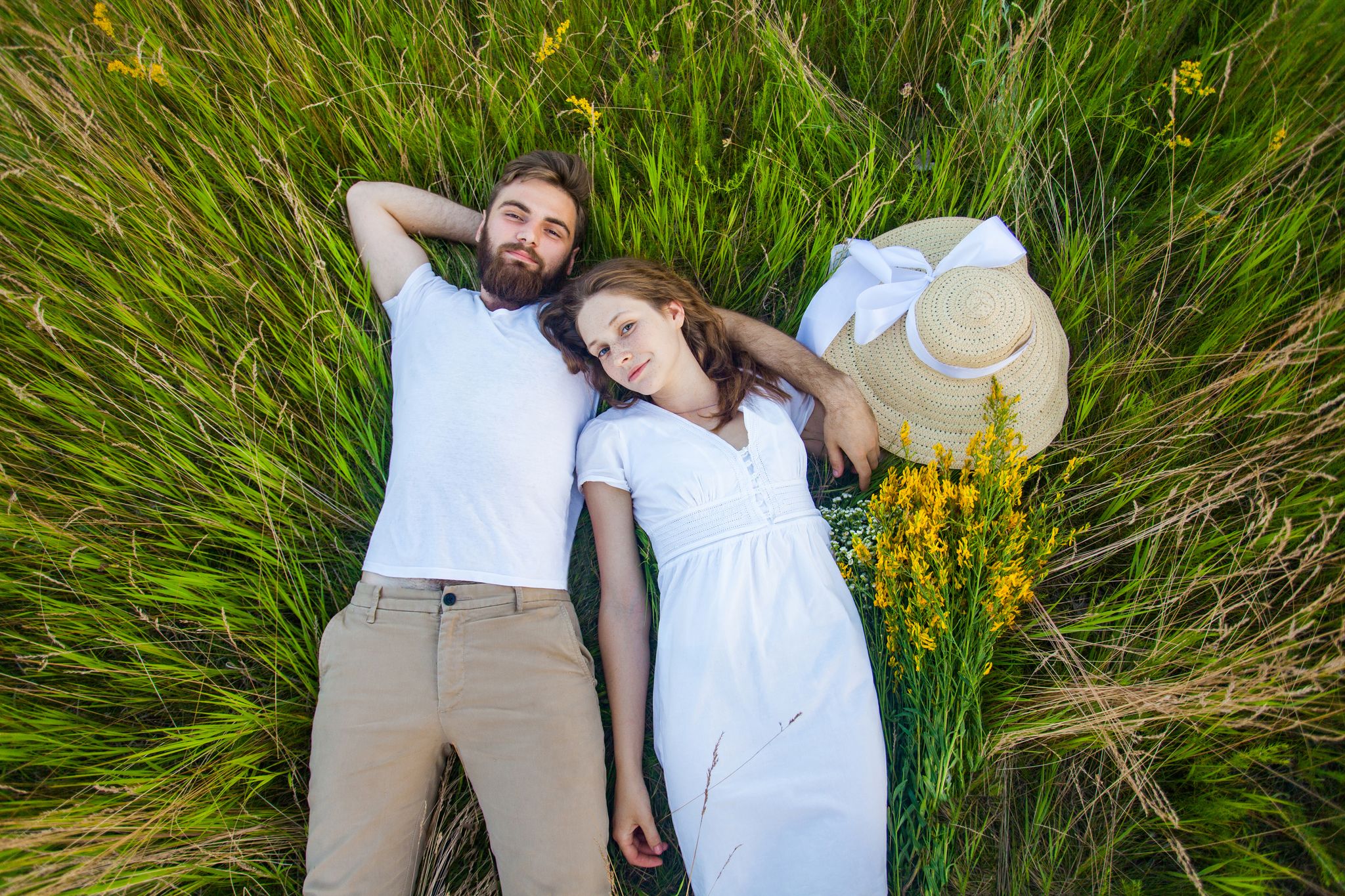 A man and woman on the grass. | Source: Shutterstock