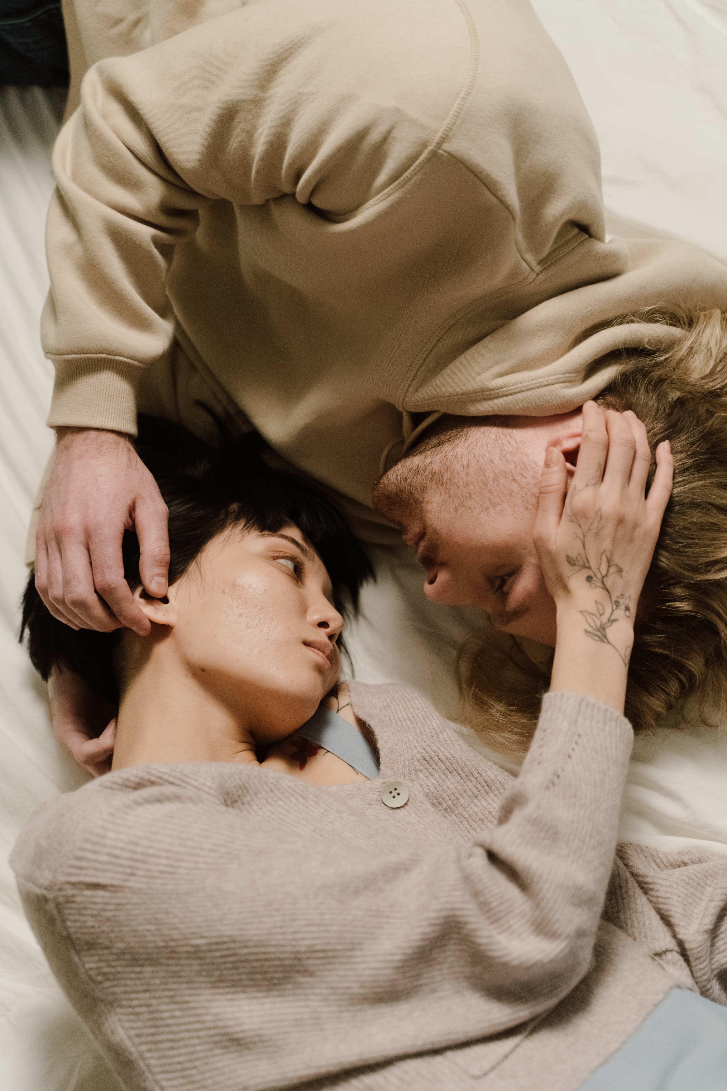 Overhead Shot of a Couple Looking at Each Other. | Source: Pexels