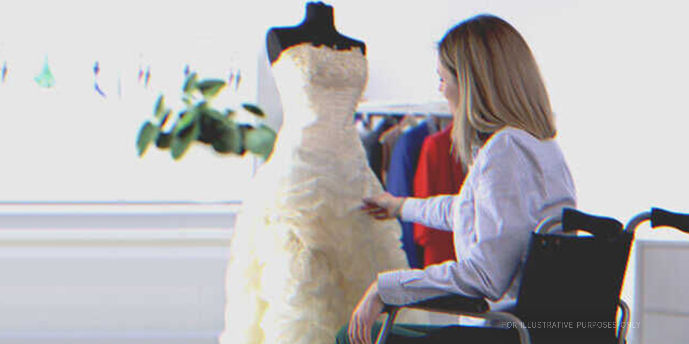 Woman in Wheelchair Admiring a Wedding Dress. | Source: Shutterstock