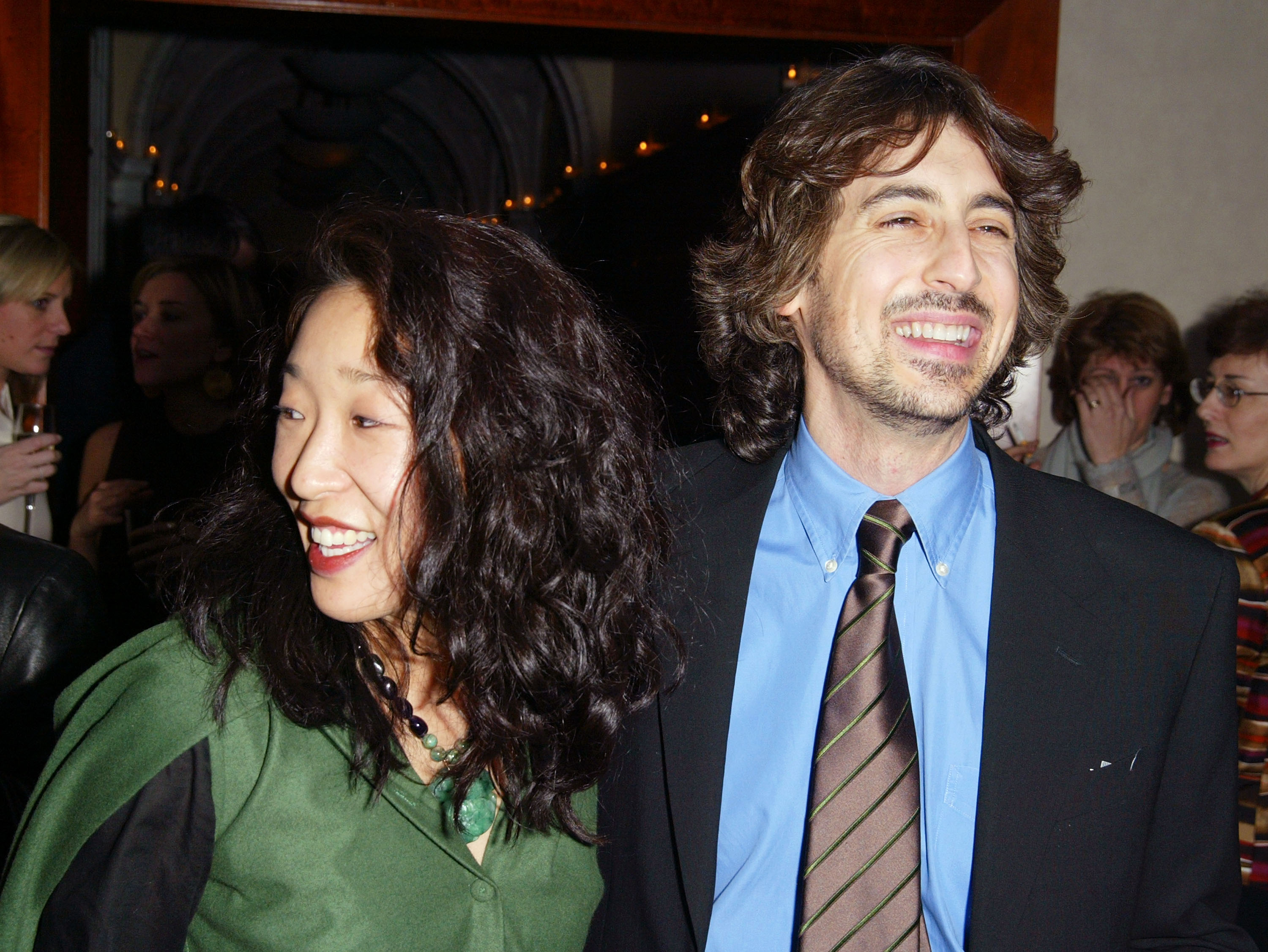 Alexander Payne and Sandra Oh, at the afterparty for the MOMA Celebration of the Films of Alexander Payne at The W Hotel Union Square, on February 25, 2003, in New York City. | Source: Getty Images