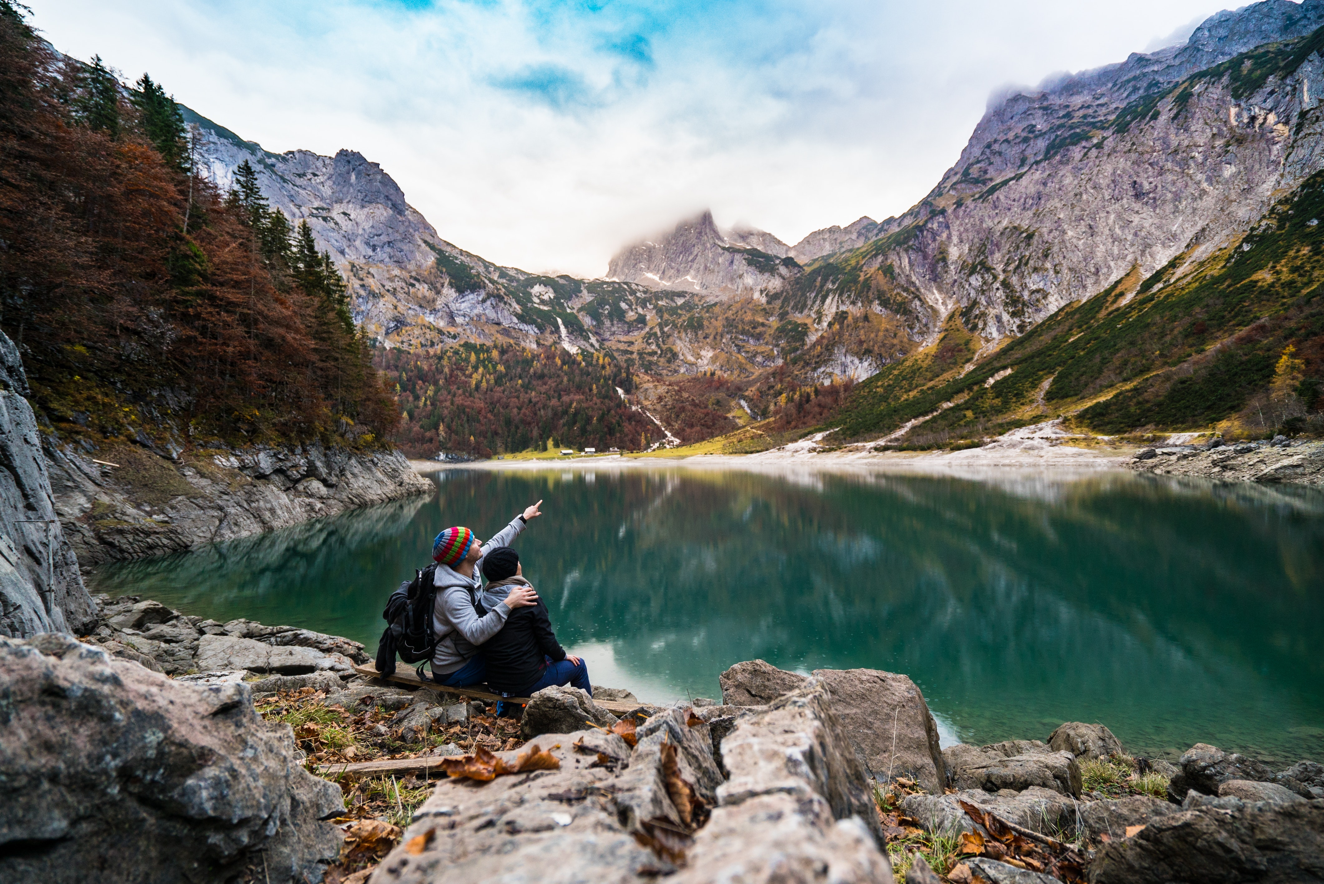Couple at scenic lake | Source: Pexels
