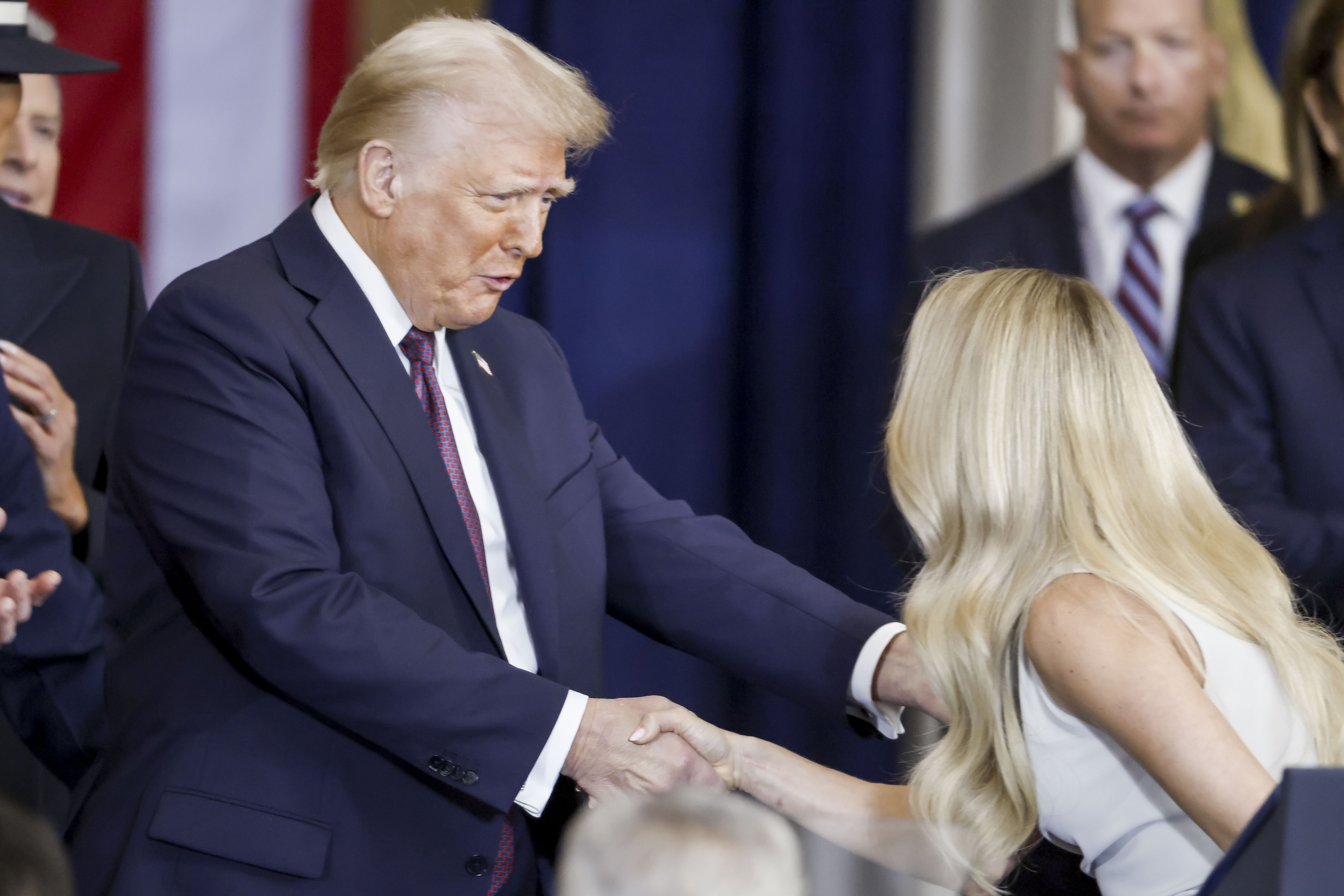 Carrie Underwood shakes hands with US President Donald Trump in Washington, DC. | Source: Getty Images