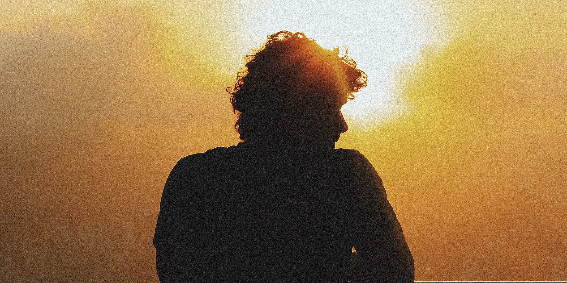 A silhouette of a man in front of a sunrise  | Source :Unsplash