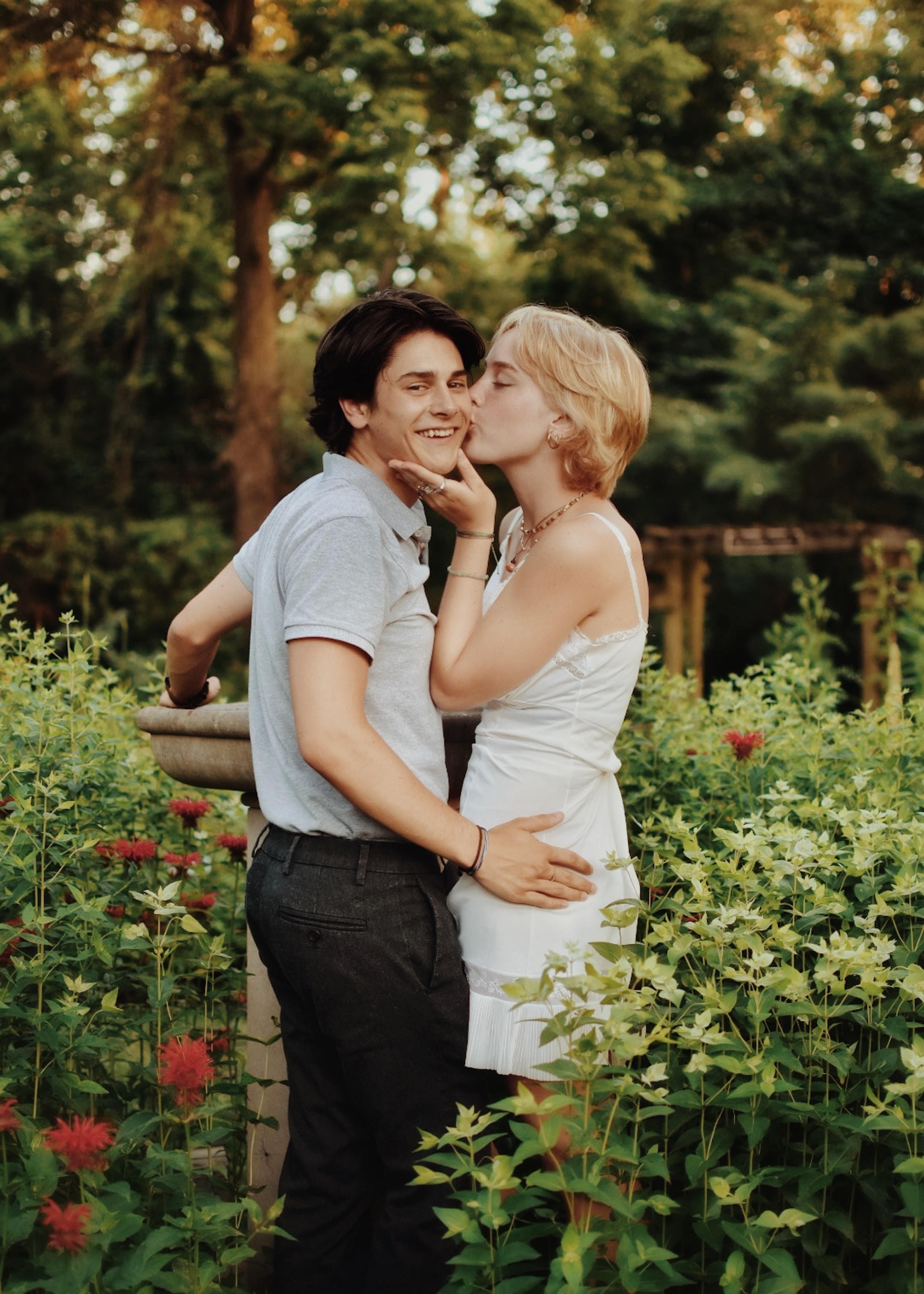 Woman kissing man on cheek. | Source: Unsplash