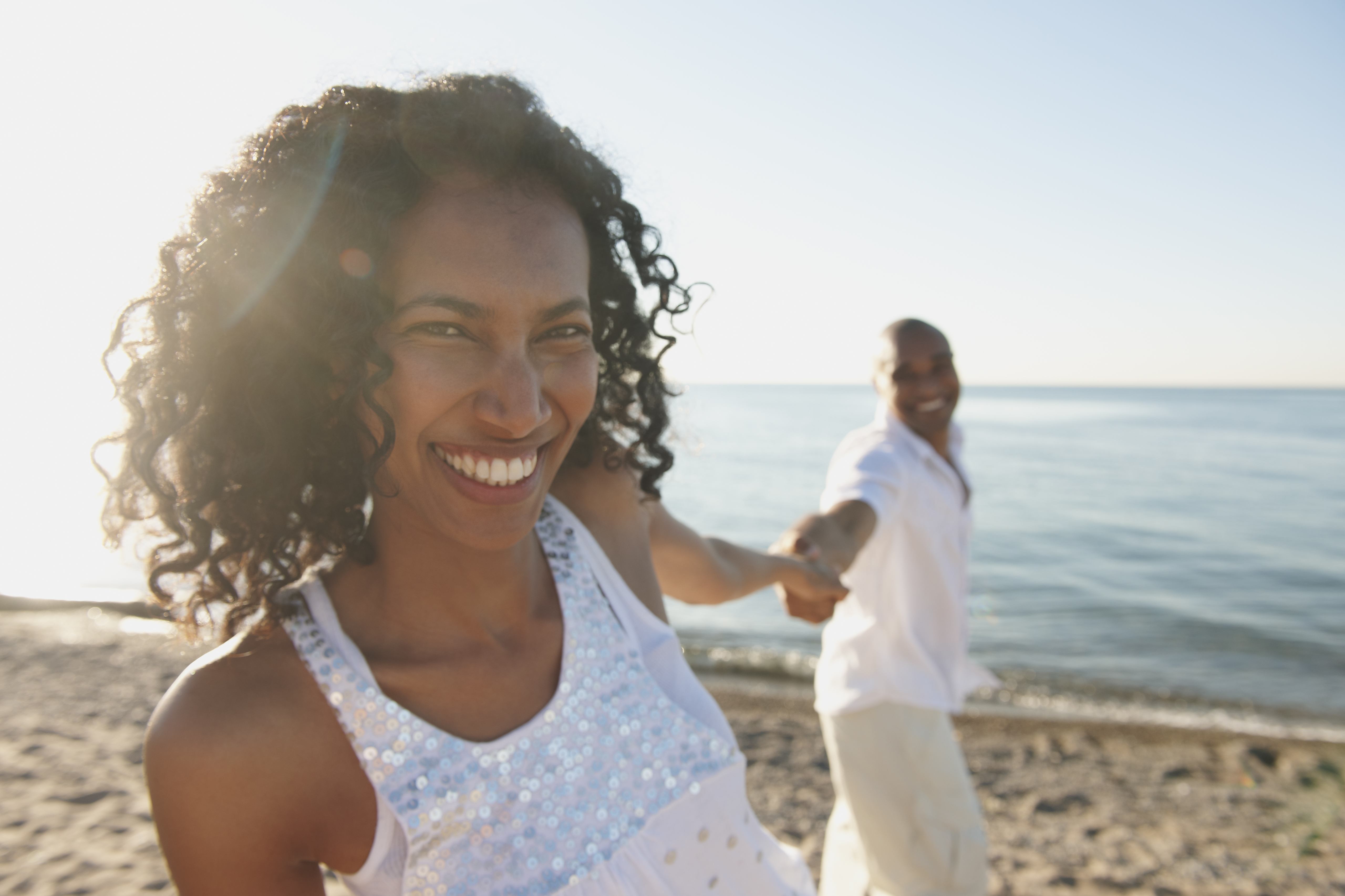 Couple chilling on the beach. | Source Getty Images