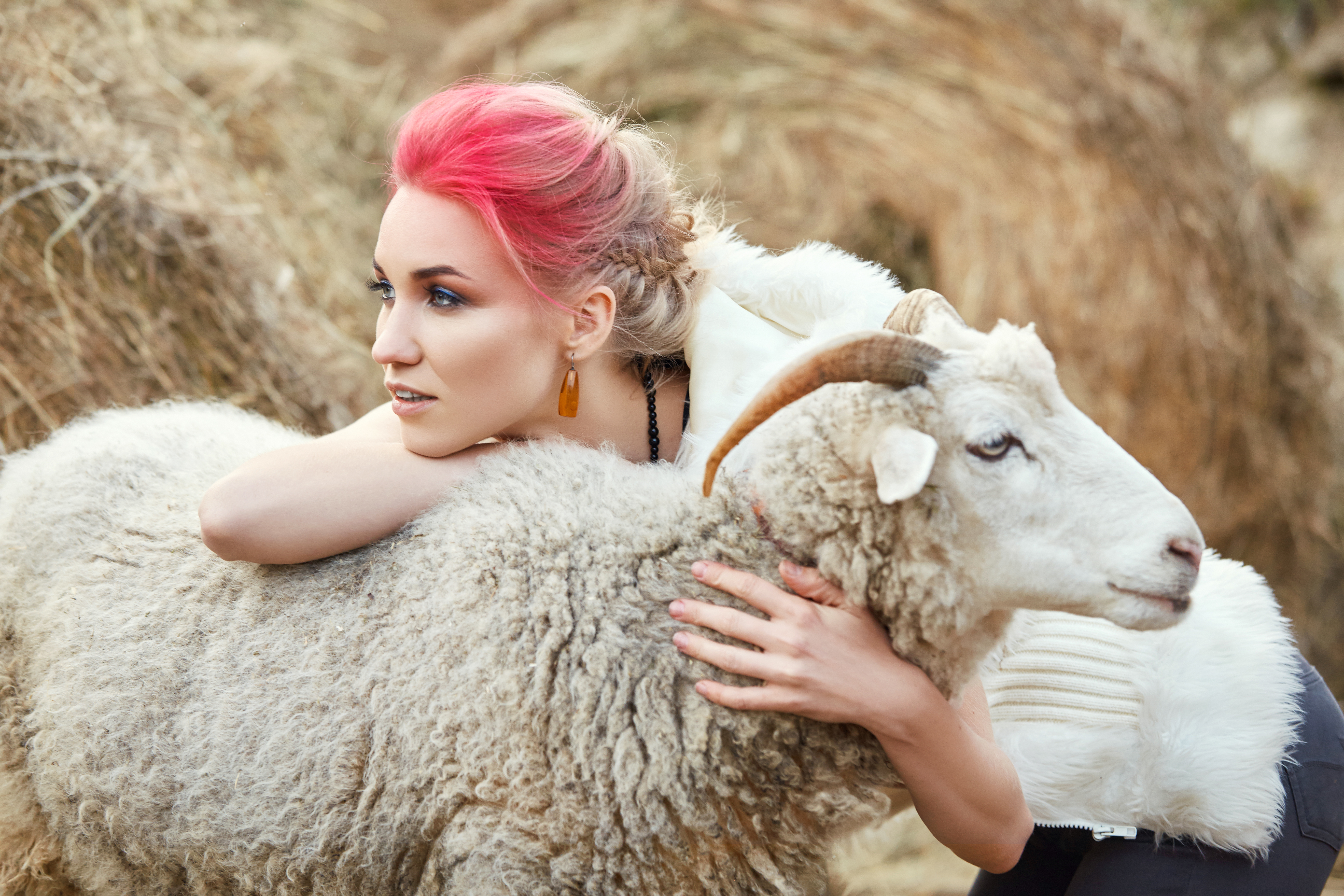 Woman hugs a ram. | Source: Getty Images
