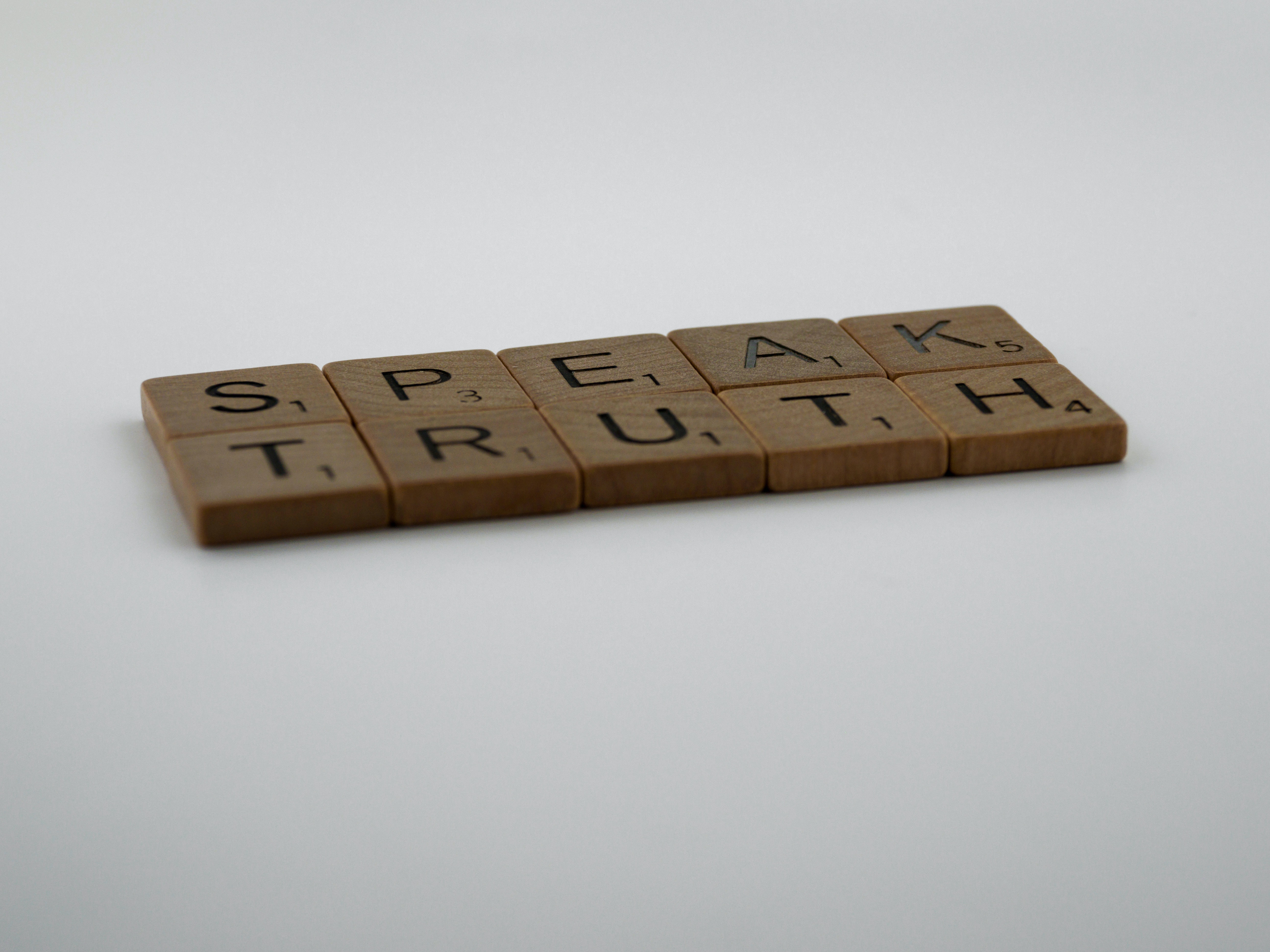 Scrabble pieces organized into the words 'Speak truth.' | Source: Unsplash