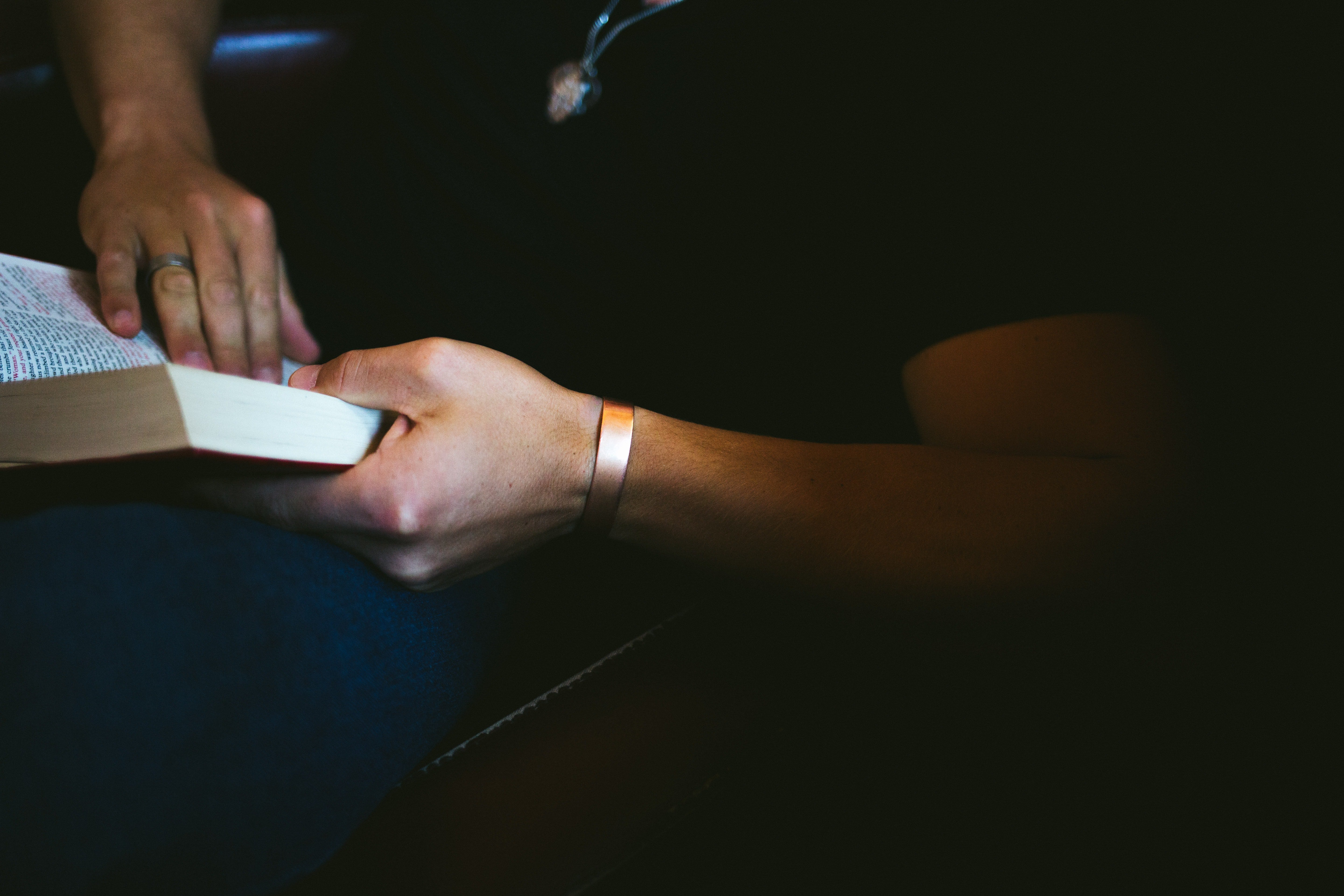 While flipping through the scriptures, Adam found a phone number with the name "Stacey." | Source: Unsplash