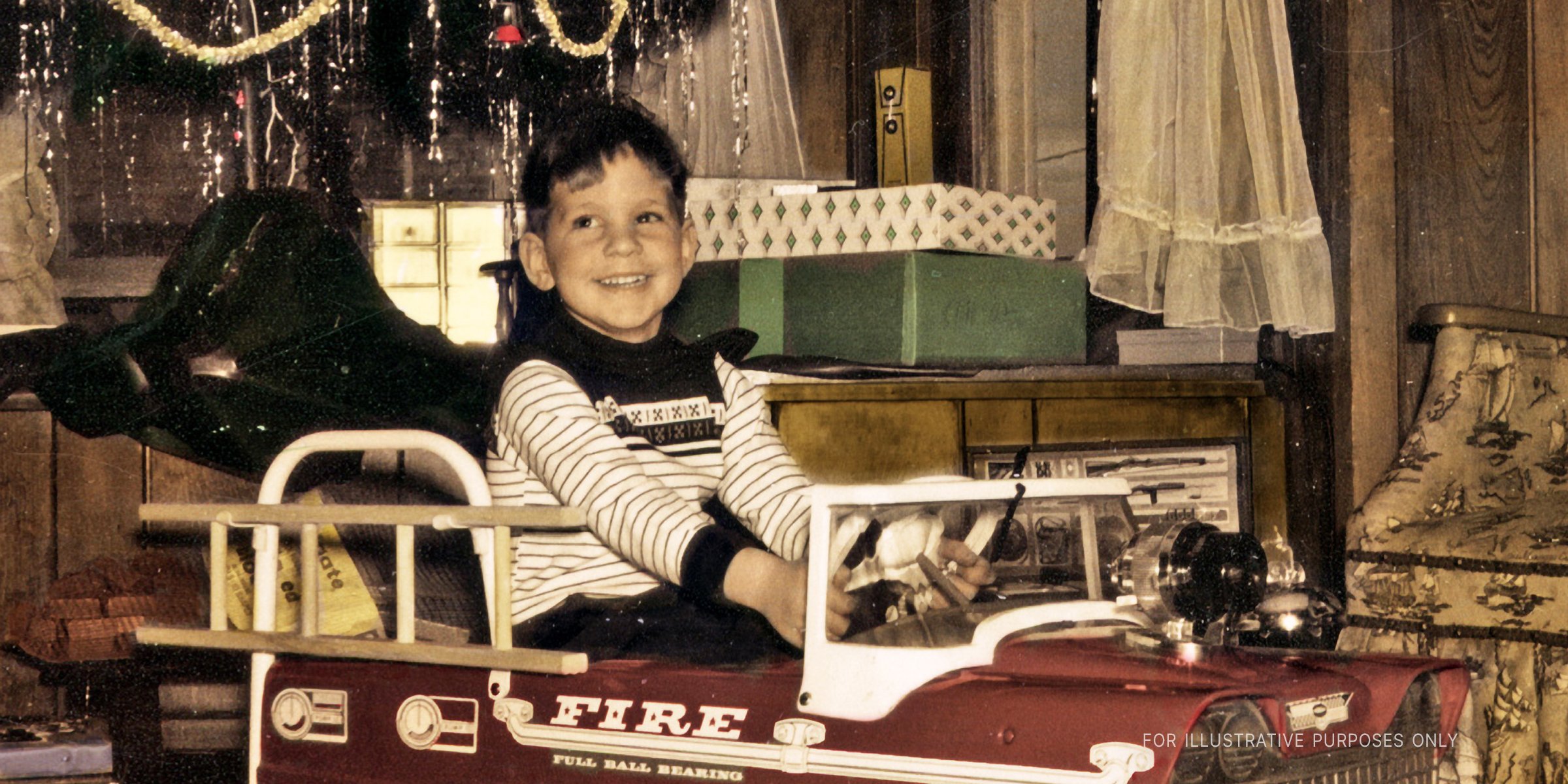 Happy Boy Driving A Toy Truck. | Source: Getty Images