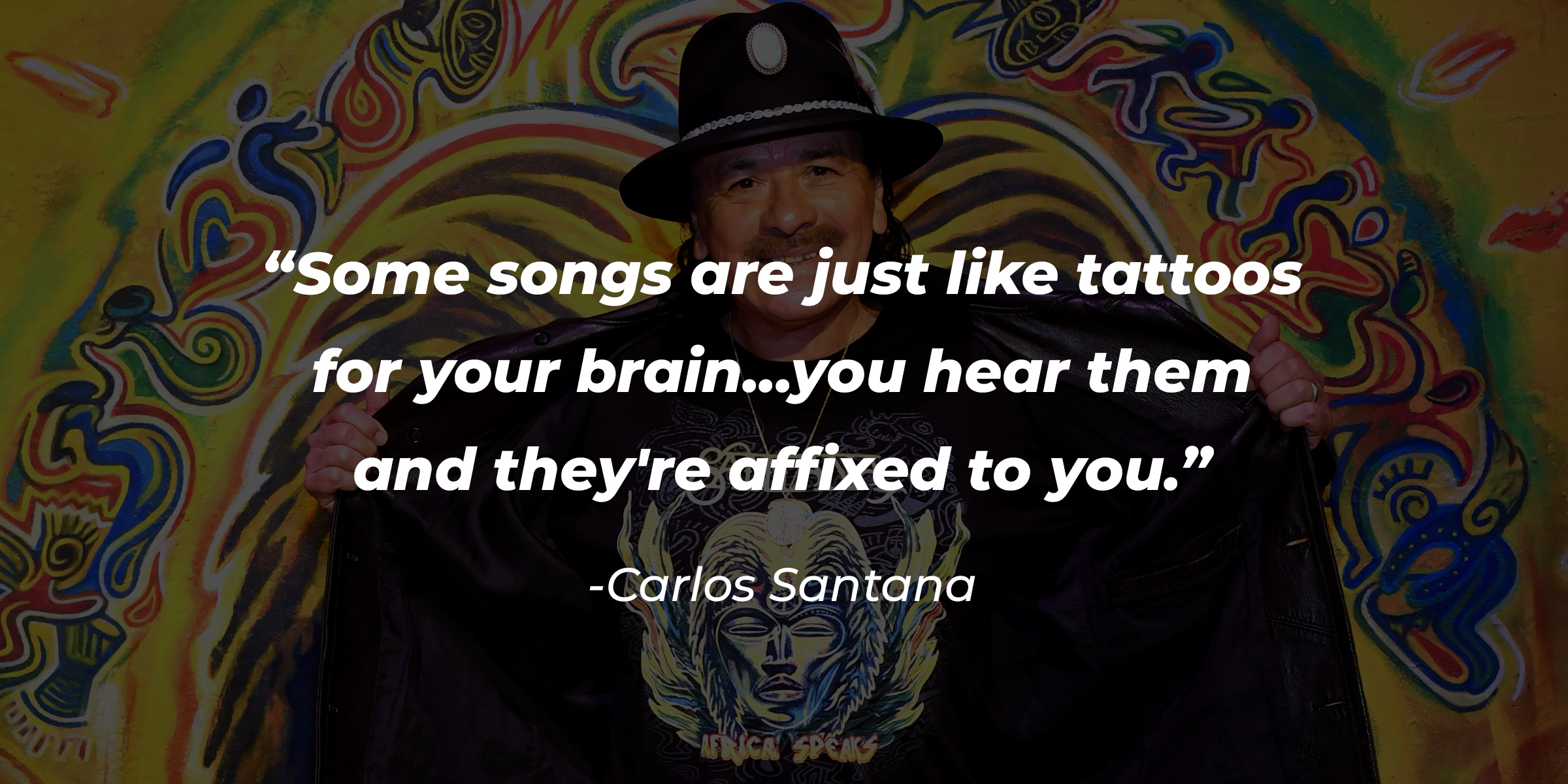 Carlos Santana with his quote: “Some songs are just like tattoos for your brain... you hear them and they're affixed to you.” | Source: Getty Images