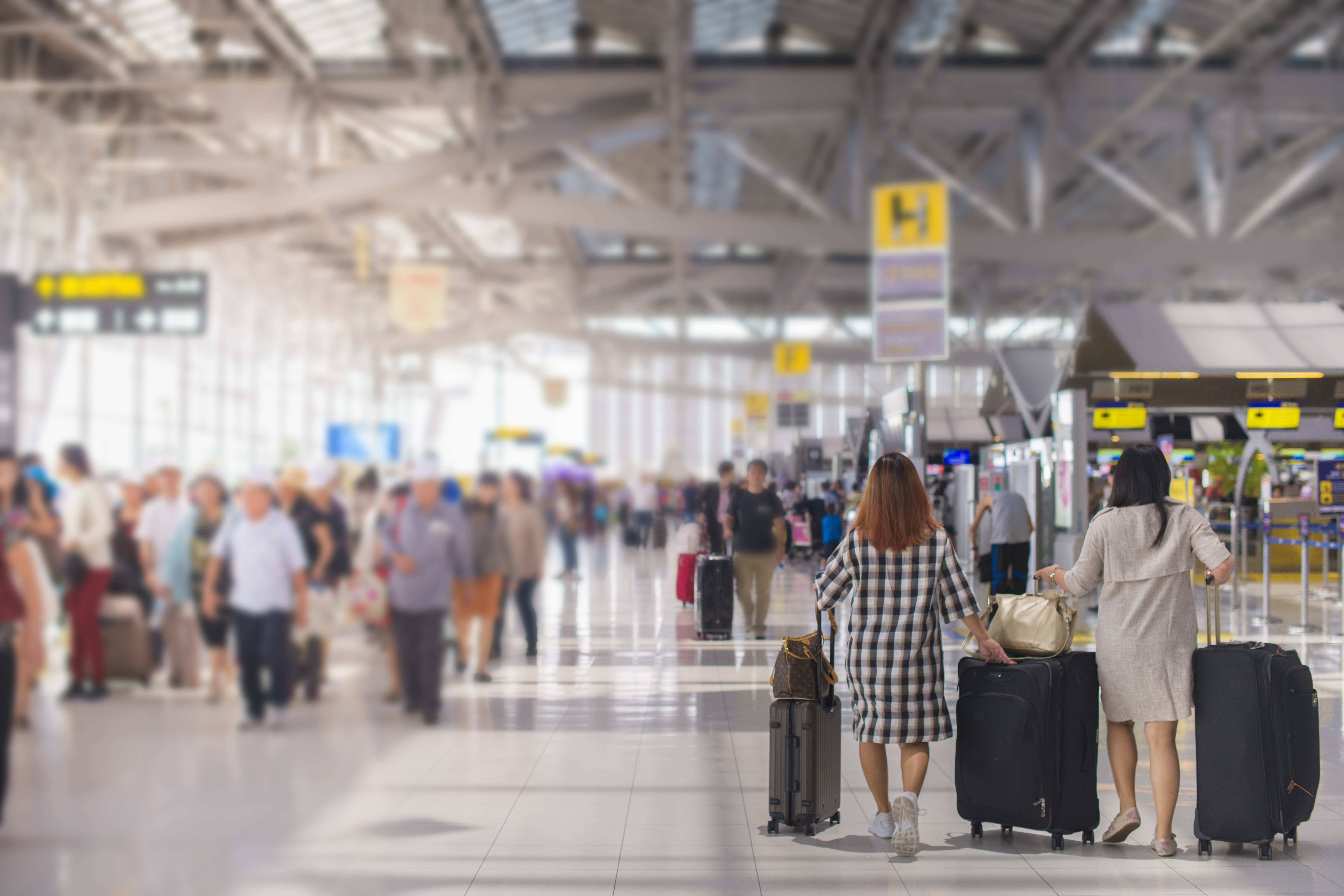 People standing at an airport terminal | Source: Shutterstock