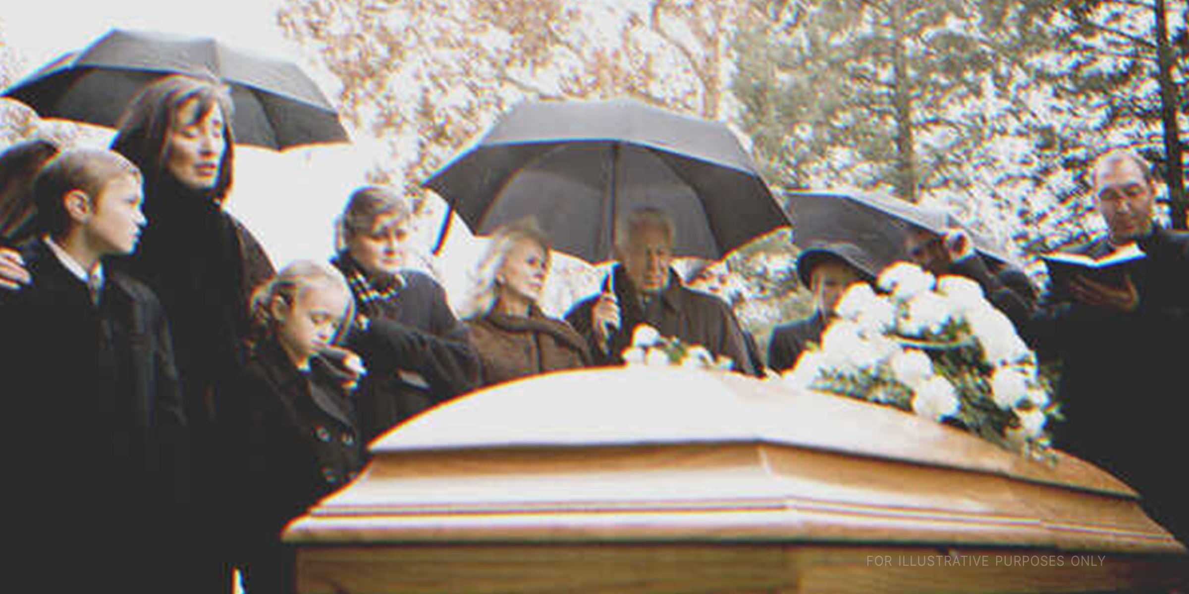 People at a funeral. | Getty Images
