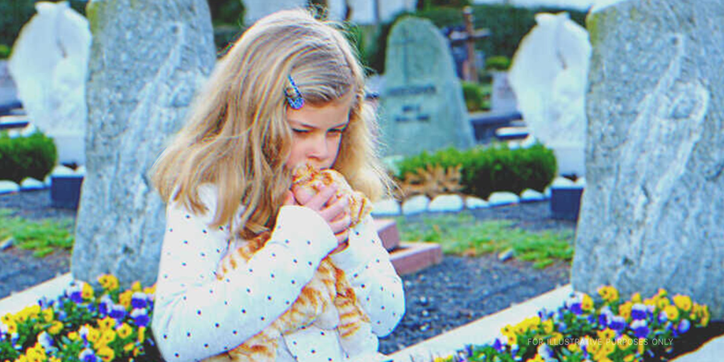 Young girl at a cemetary holding a soft toy | Source: Shutterstock