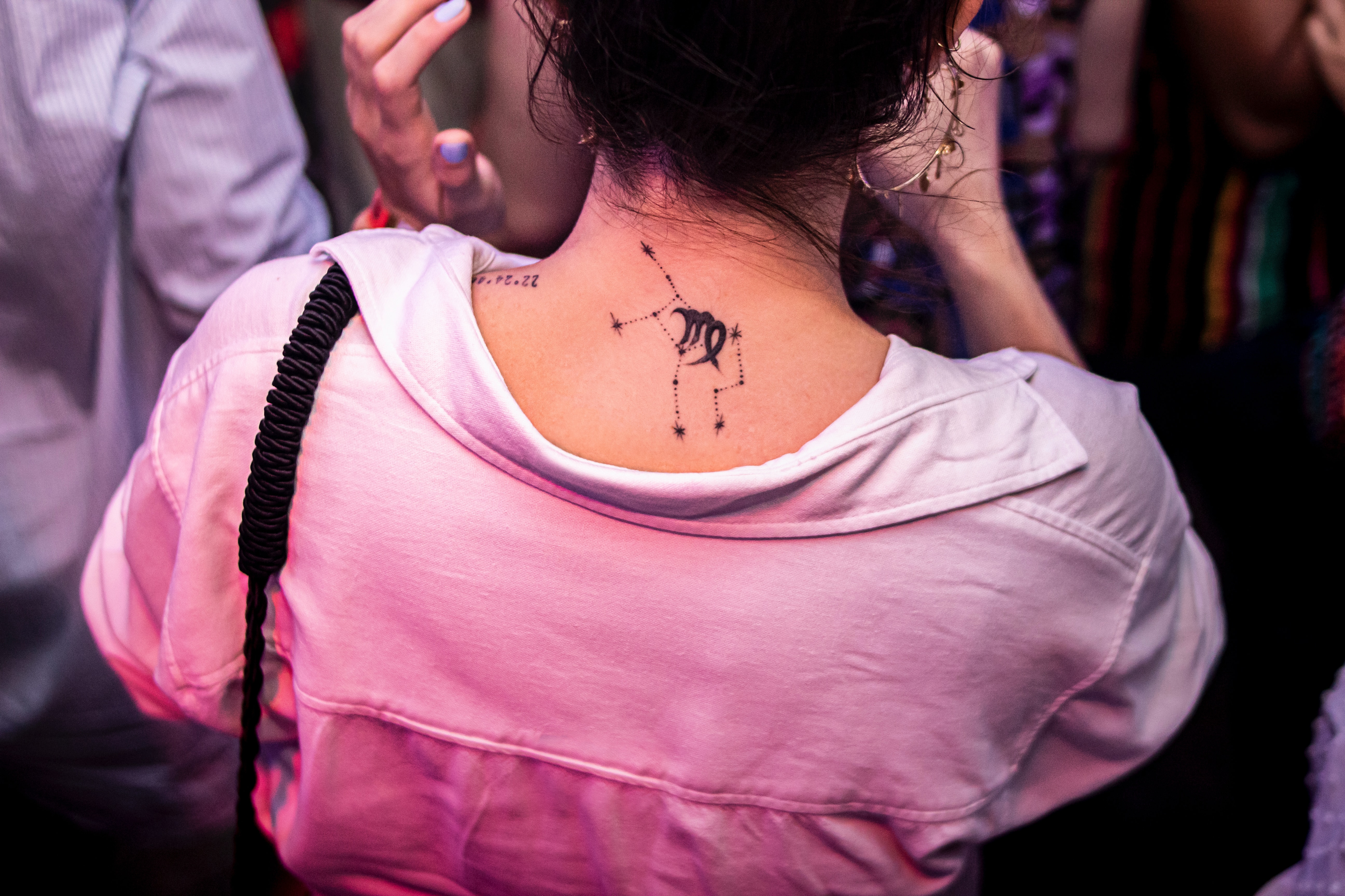 Woman with a zodiac tattoo. | Source: Unsplash