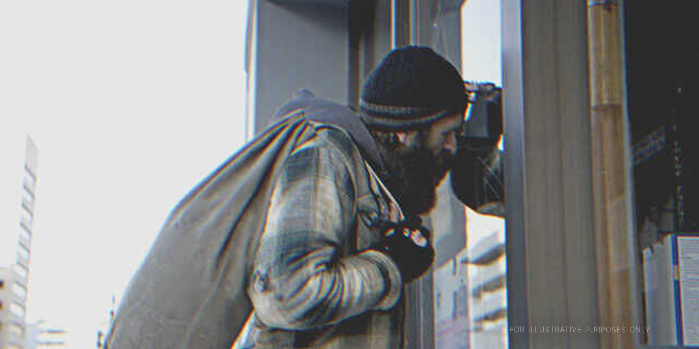 Beggar Peeping Through Glass Window. | Source: Getty Images