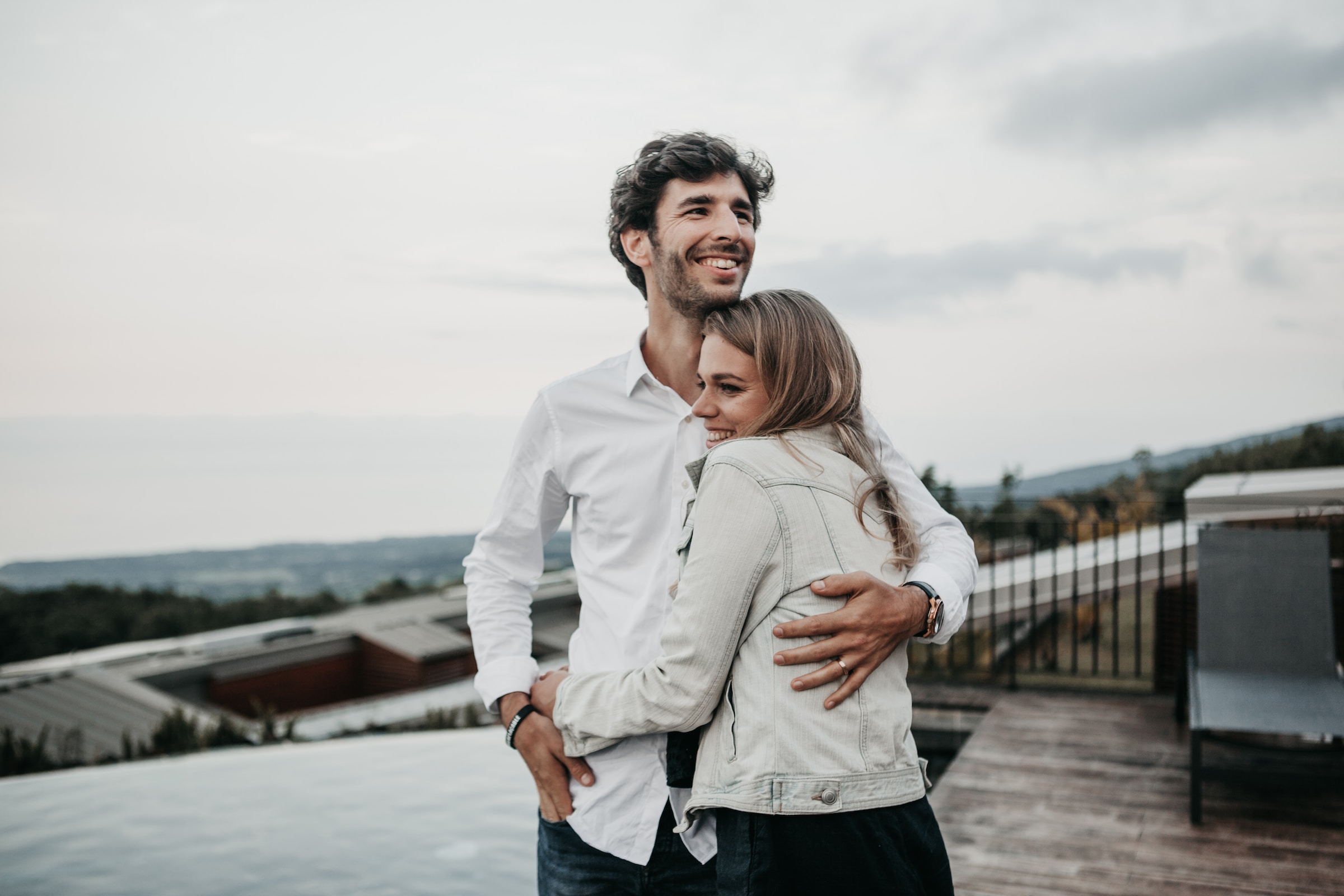Couple embracing and smiling. | Source: Unsplash