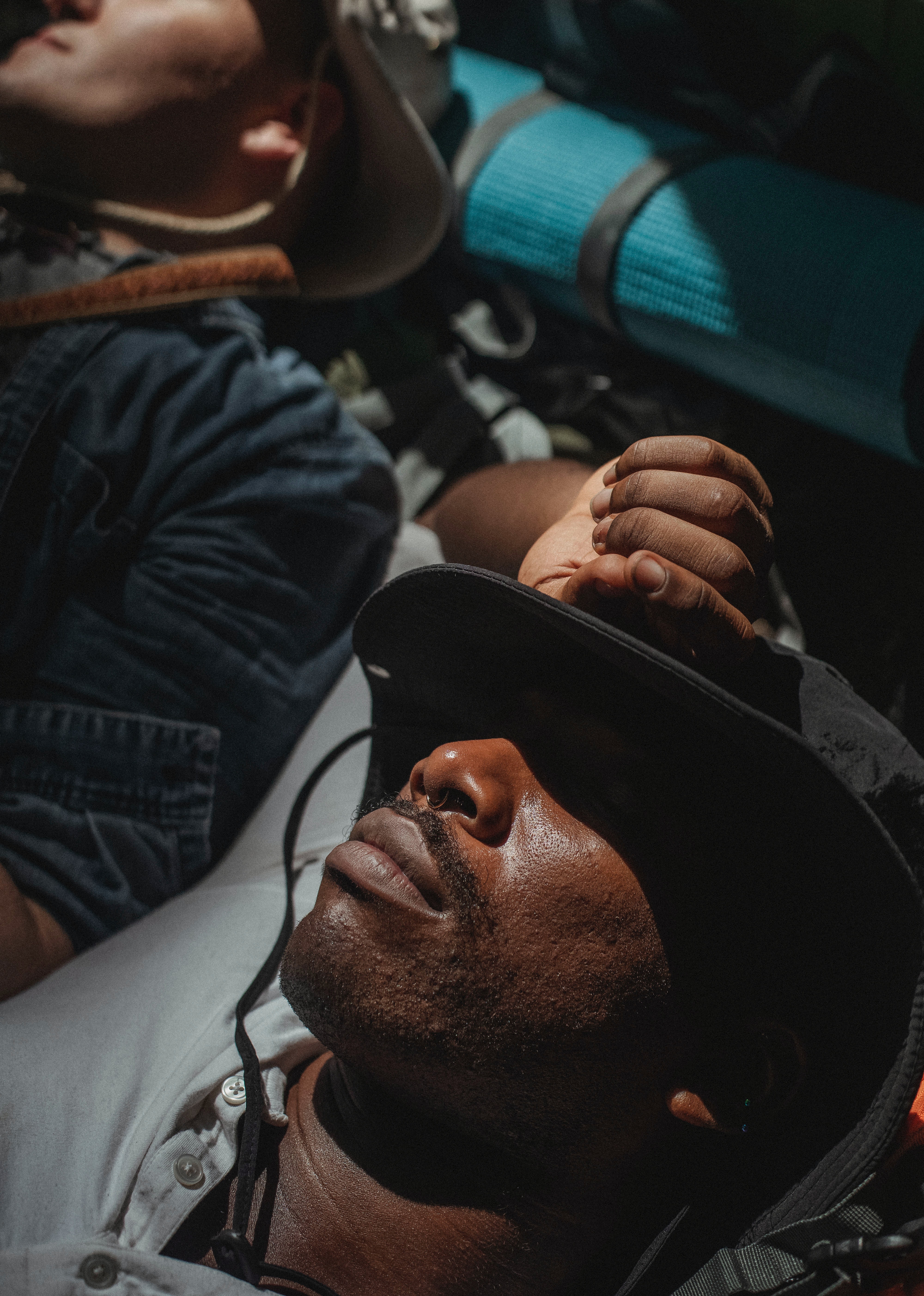 A man with a hat covering his eyes. | Source: Pexels