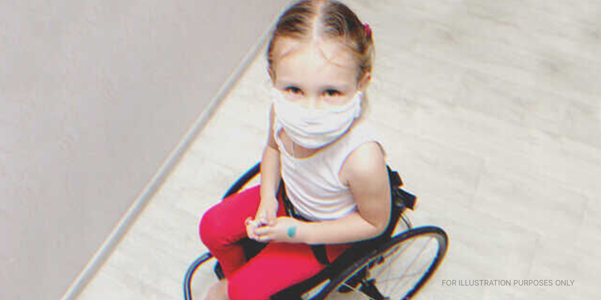 A little girl on a wheelchair | Source: Shutterstock