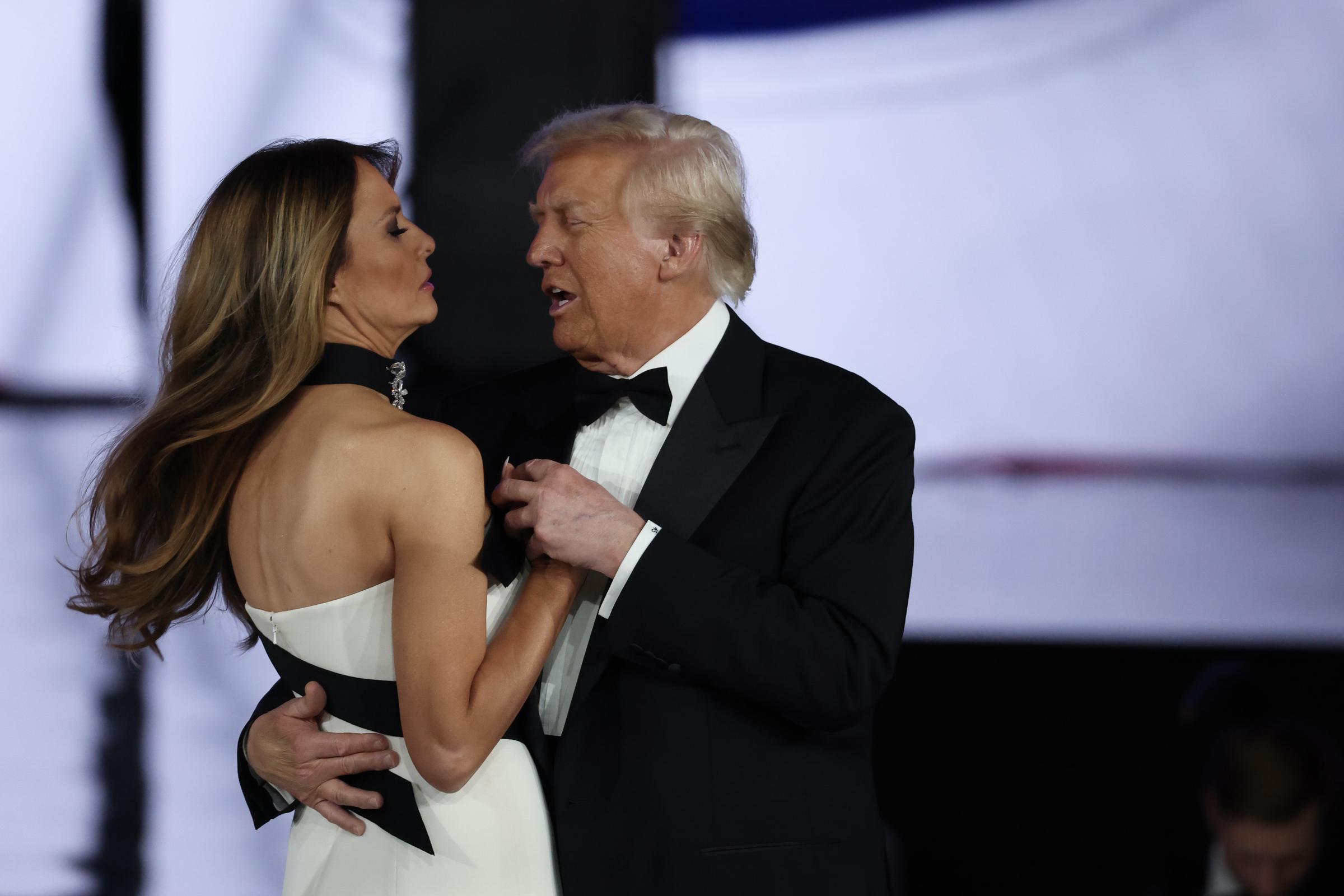 Donald Trump speaking to Melania Trump as they dance at the Liberty Inaugural Ball. | Source: Getty Images