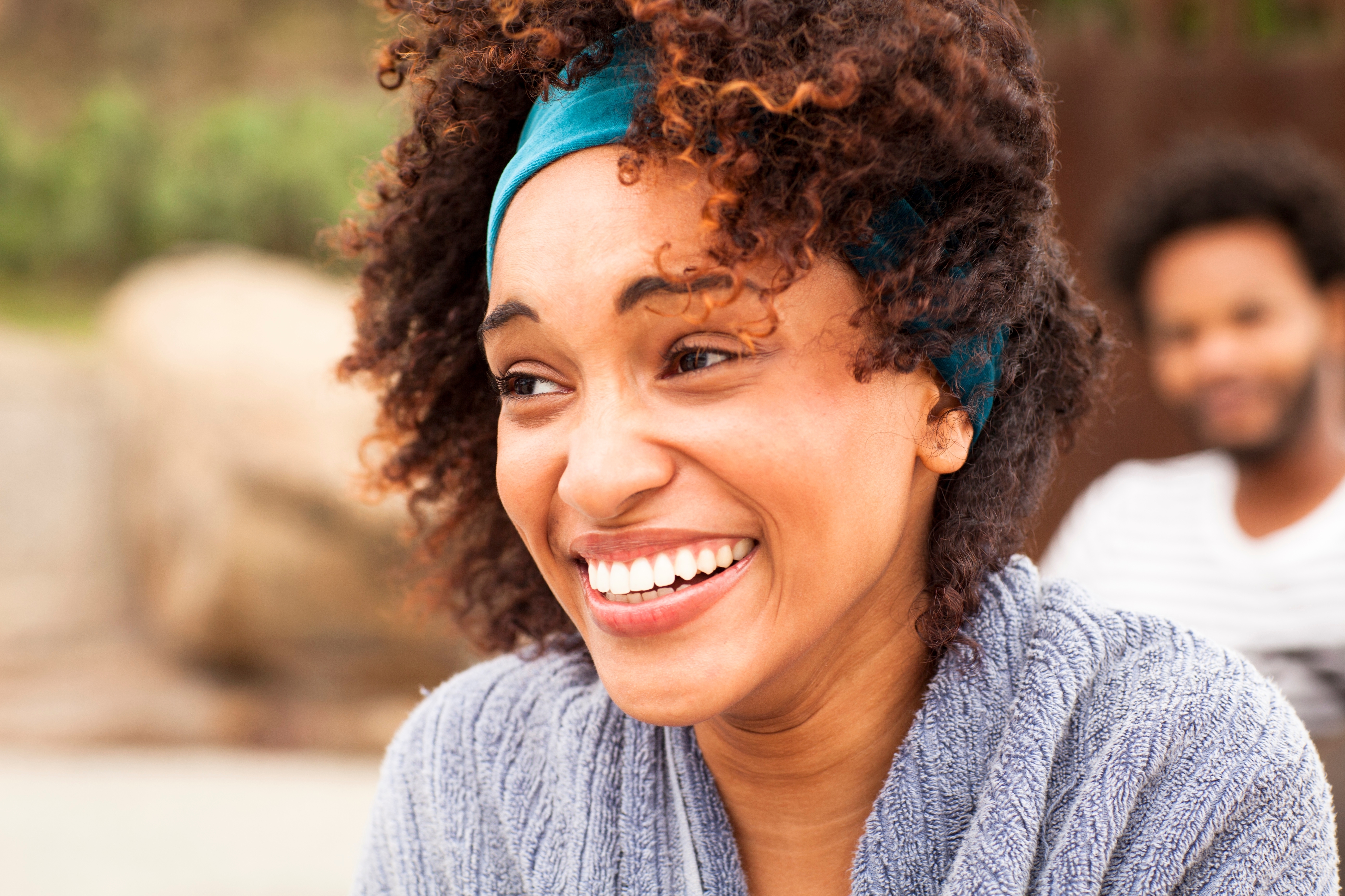 A woman with her hair blowing in the wind. | Source Shutterstock