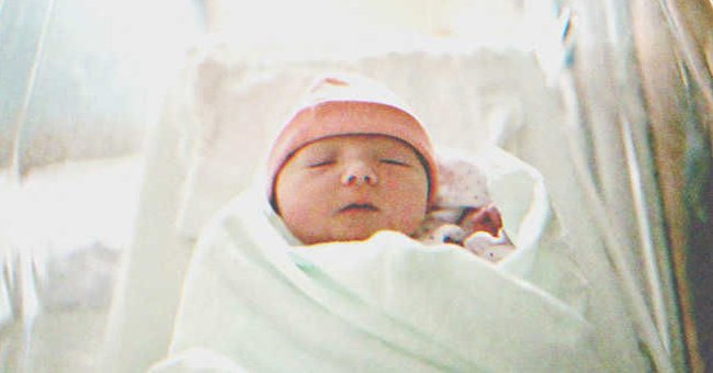 A baby sleeping in a crib | Source: Shutterstock