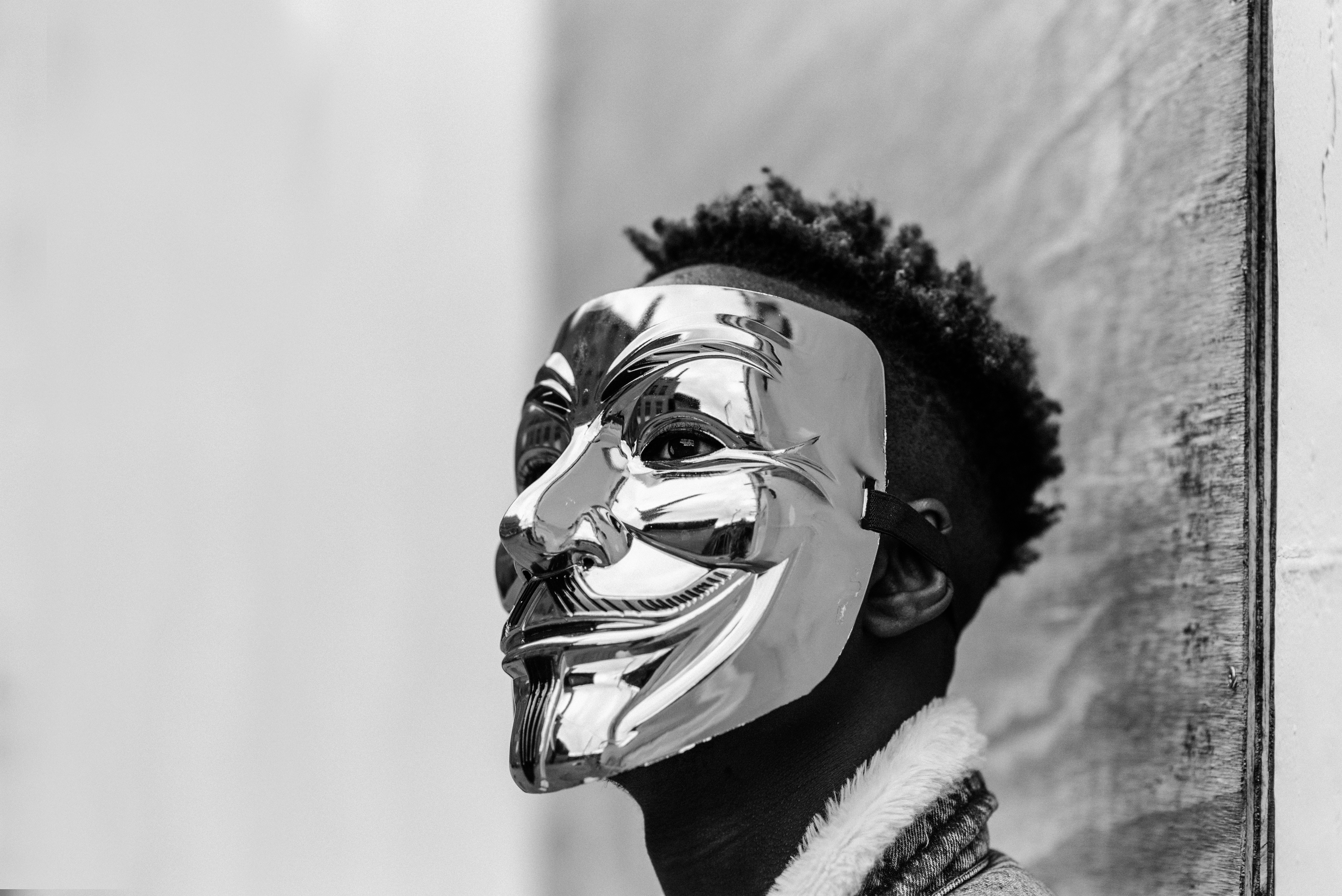 A man wearing an anonymous mask. | Source: Pexels