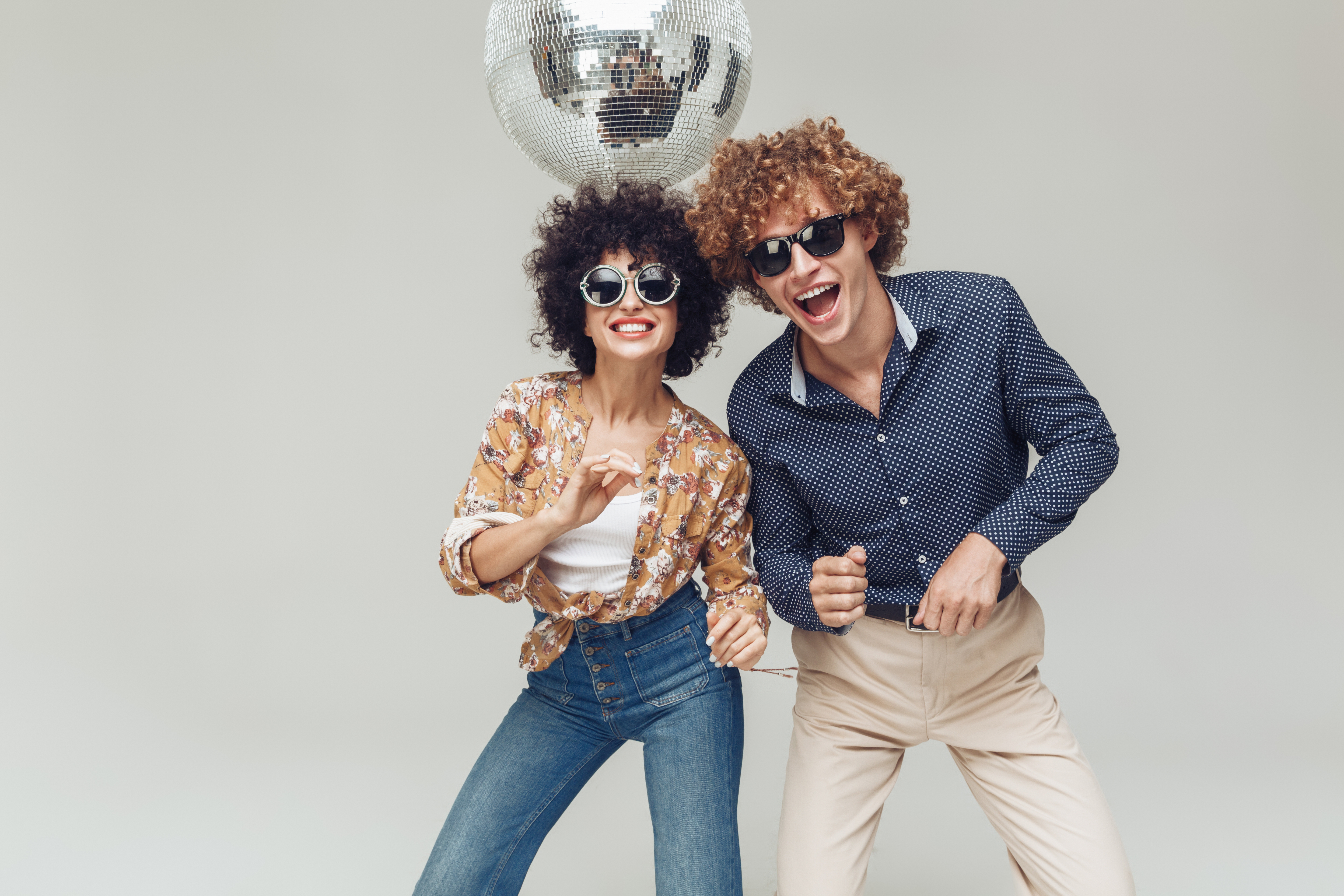 A young couple posing happily for a photo | Source: Shutterstock