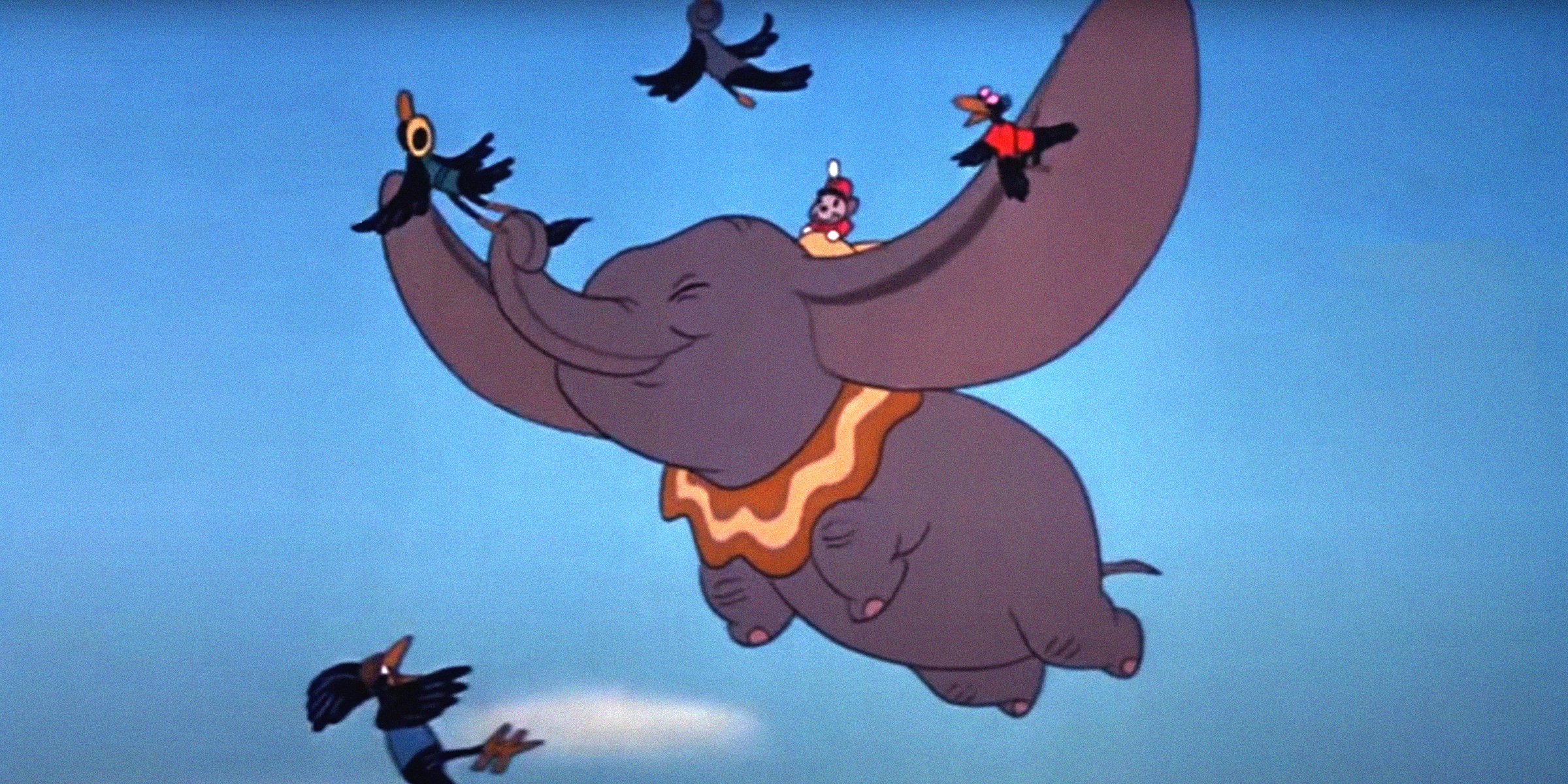 facebook.com/DisneyDumbo | Dumbo flying with crows and Timothy Q. Mouse on his back