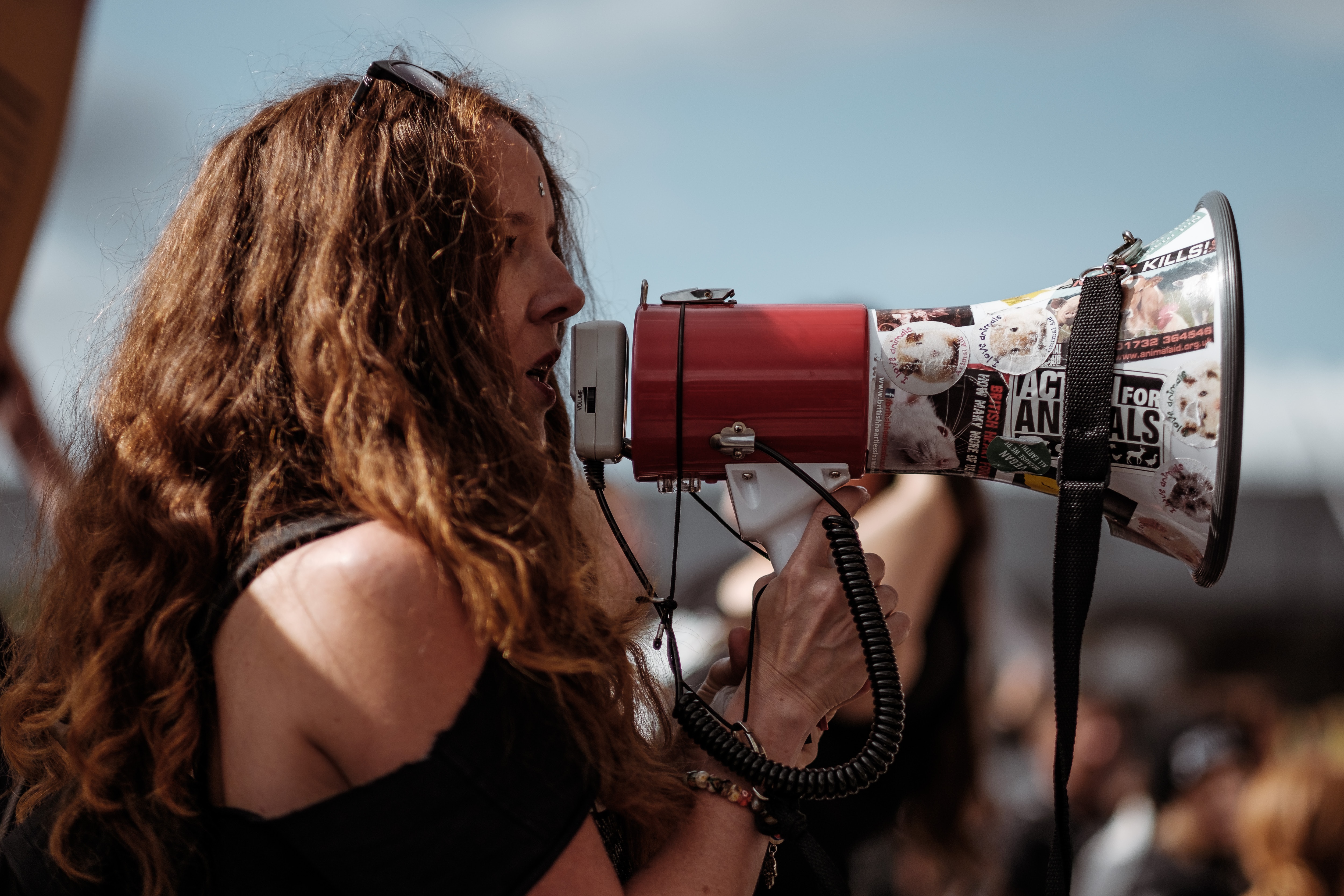 A woman speaking through a megaphone. | Source: Unsplash