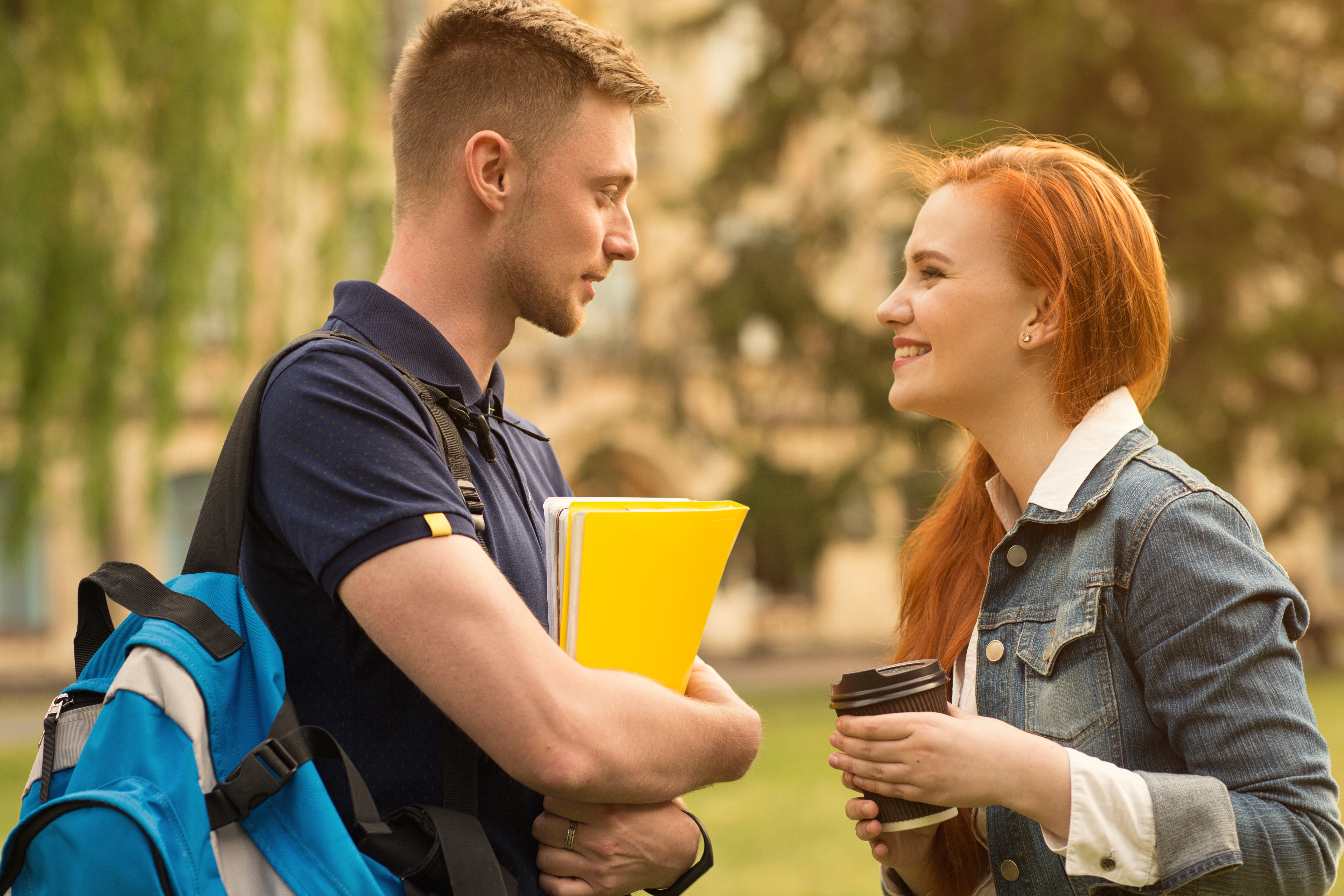 Two students smiling at each other | Source: Shutterstock