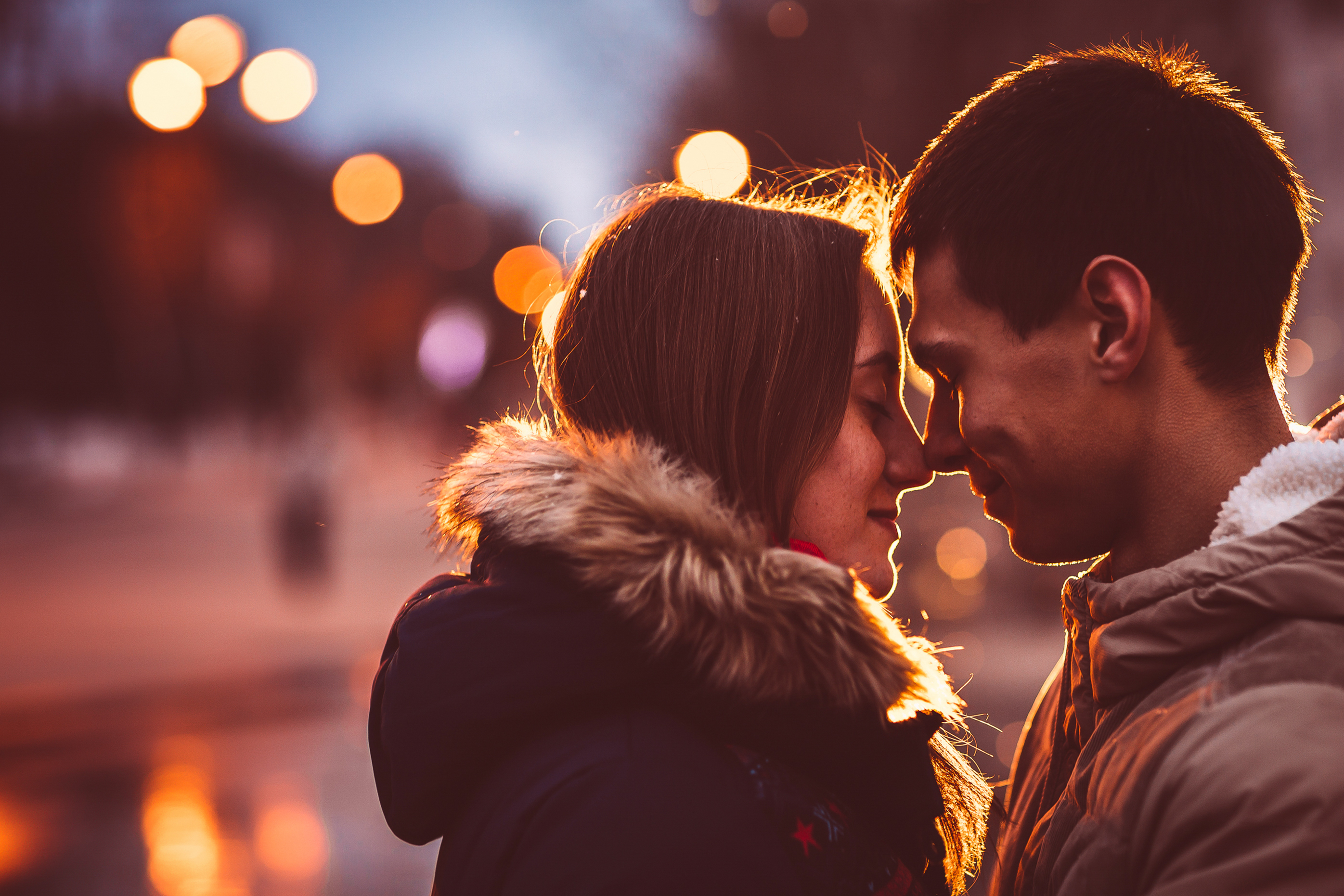 A close-up photo of a couple nuzzling each other | Source: Shutterstock