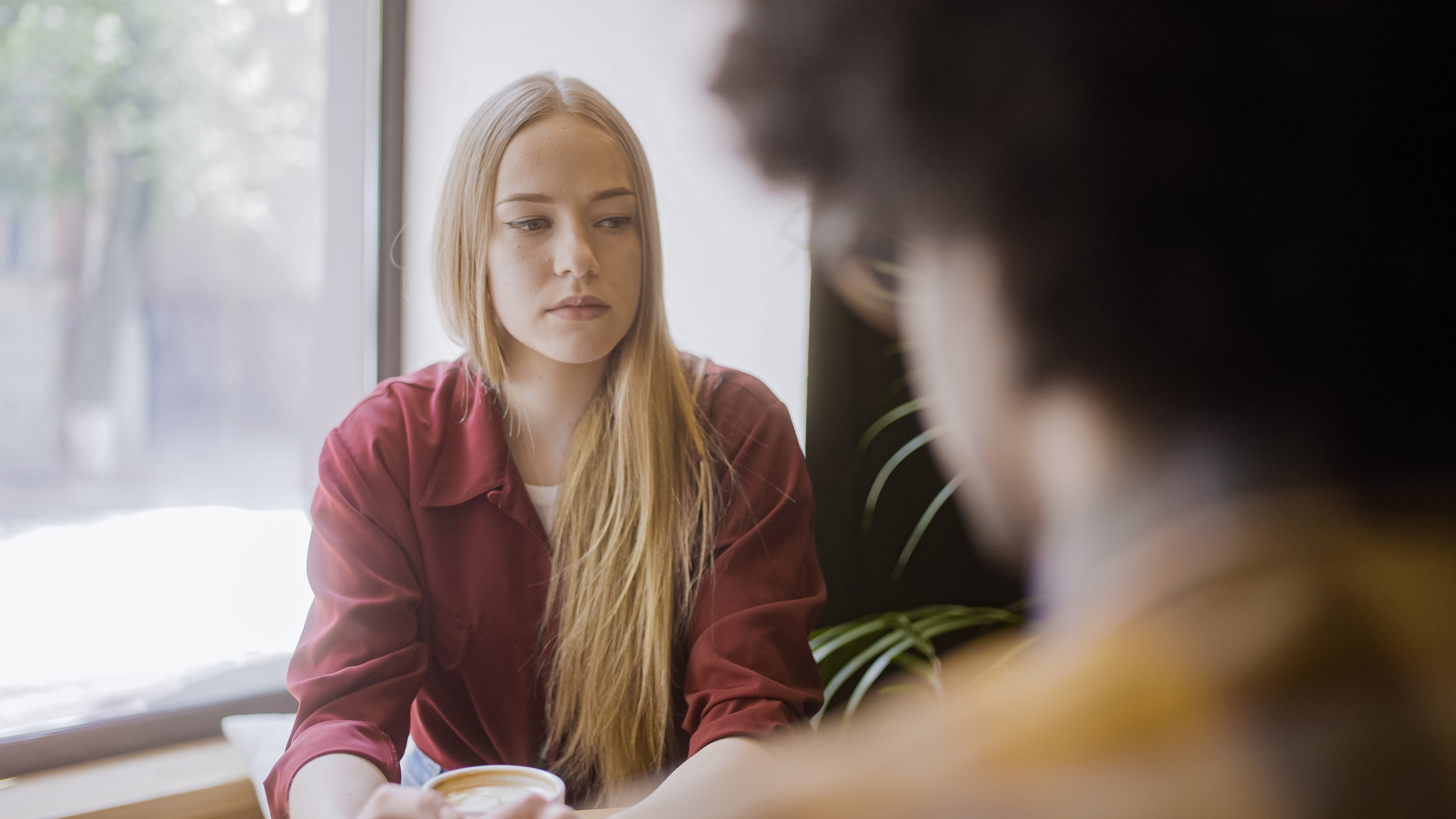 A women who seems upset looking away from her partner | Source: Shutterstock