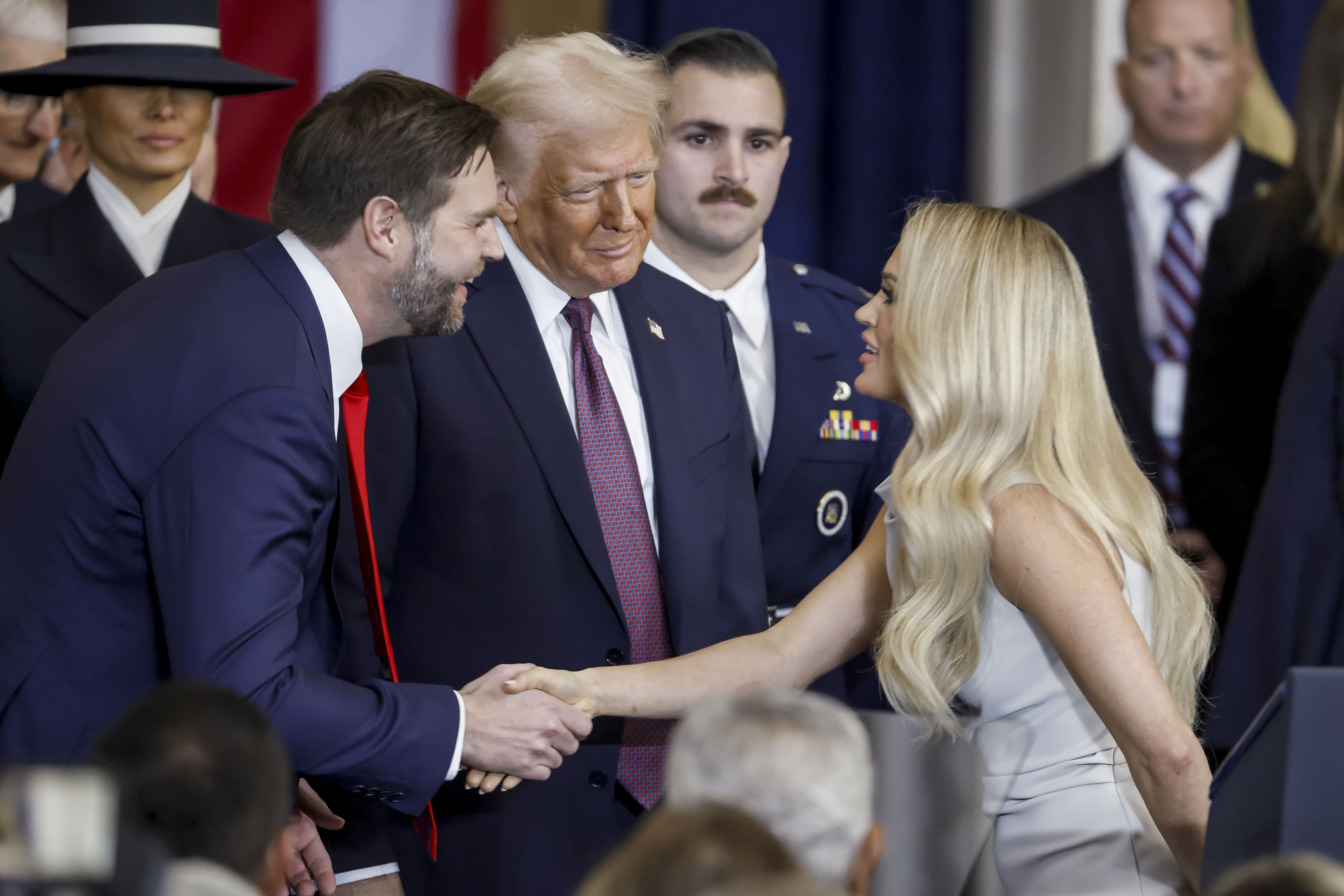 Carrie Underwood with JD Vance and Donald Trump after performing "America the Beautiful" during the inauguration. | Source: Getty Images