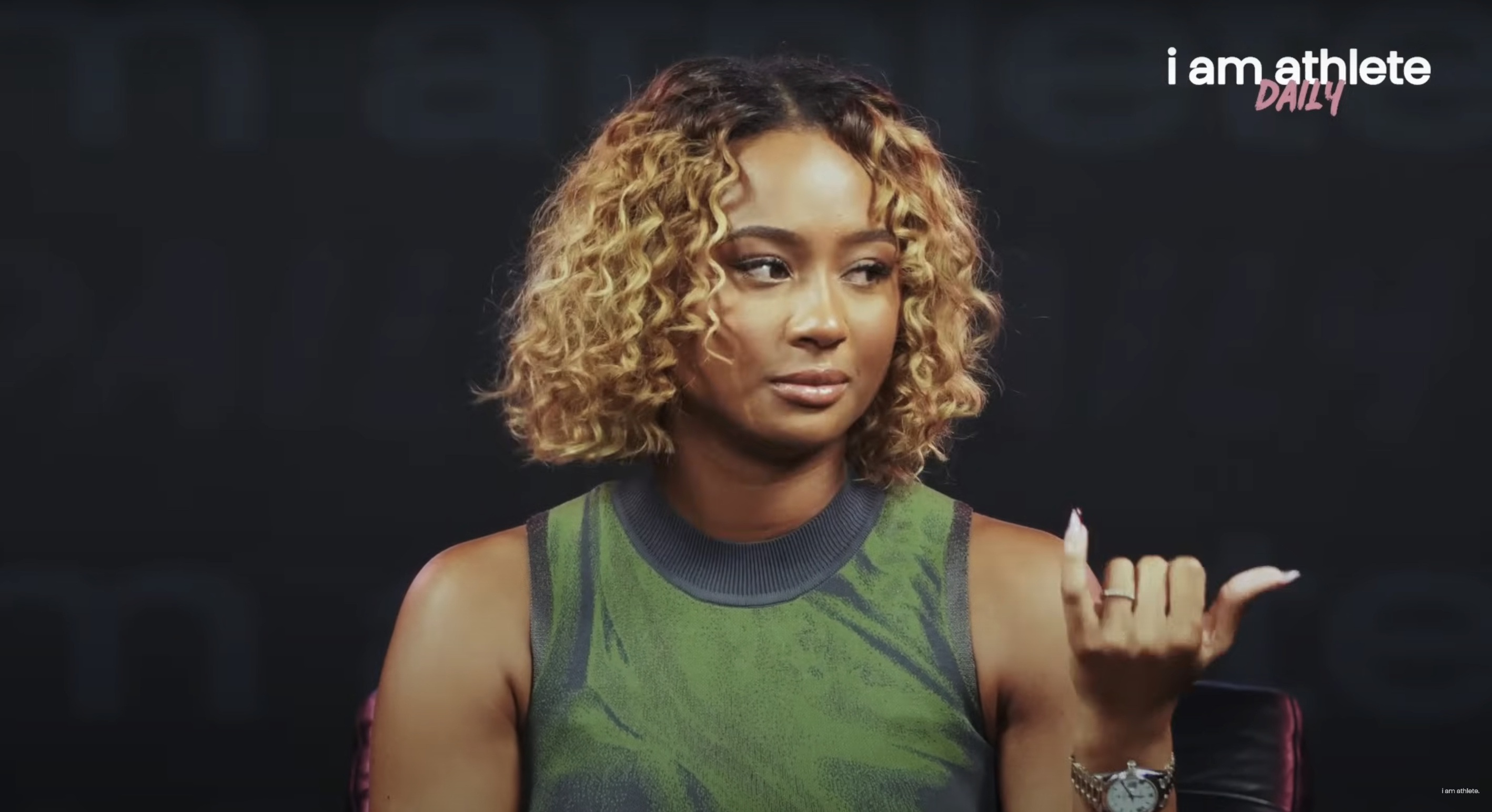 Kayla Nicole looks emotional during her appearance on the "I Am Athlete" podcast, dated October 15, 2024 | Source: YouTube/IAMATHLETE