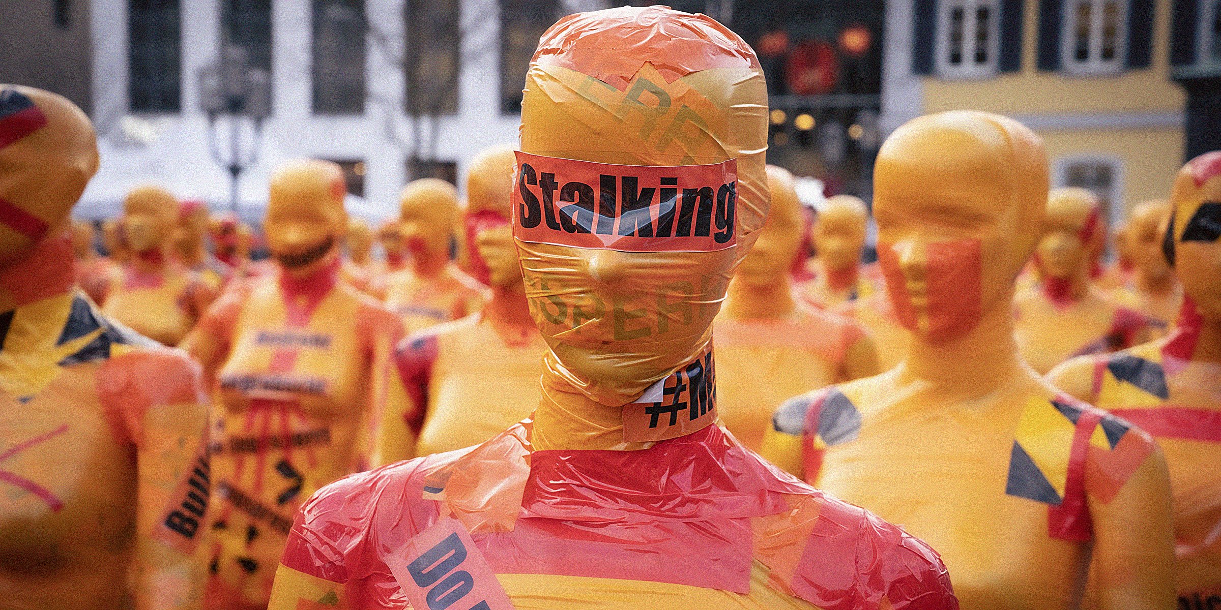 Unsplash  | A mannequin wrapped in plastic with the words 'stalking' written over a sticker over their eyes