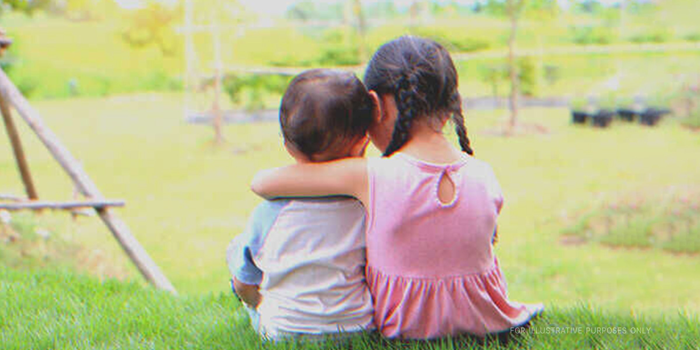 Little Girl Hugging Her Brother. | Source: Shutterstock