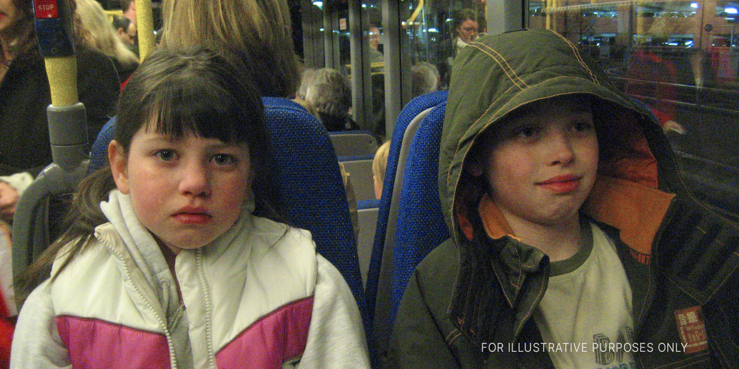 Two children on bus | Source: Flickr
