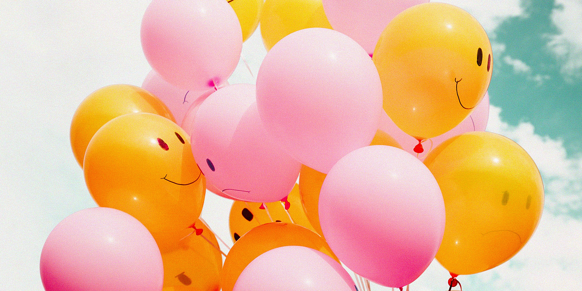 Unsplash | A bunch of orange and pink balloons