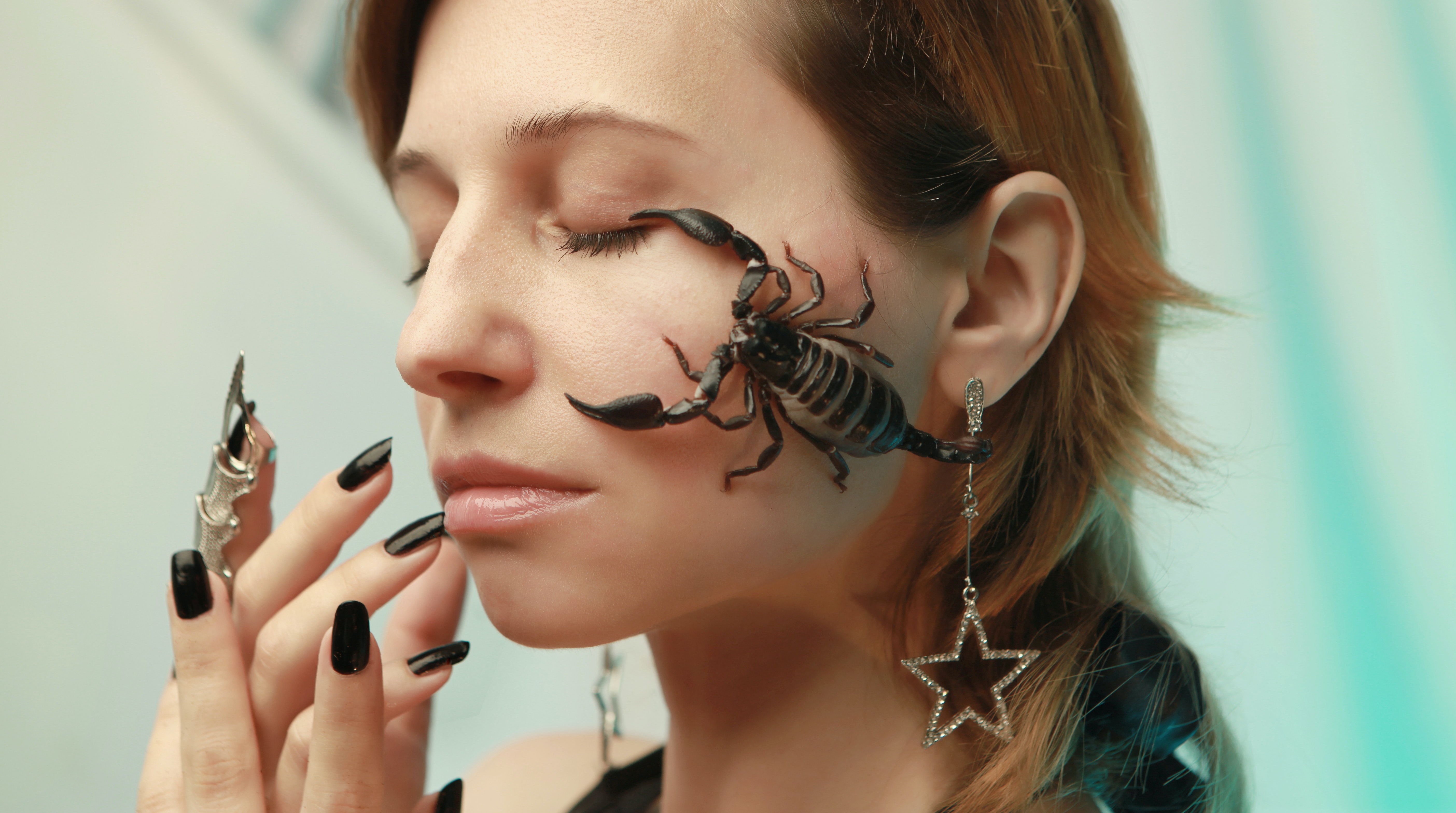 A woman with a Scorpion on her face. | Source: Pexels