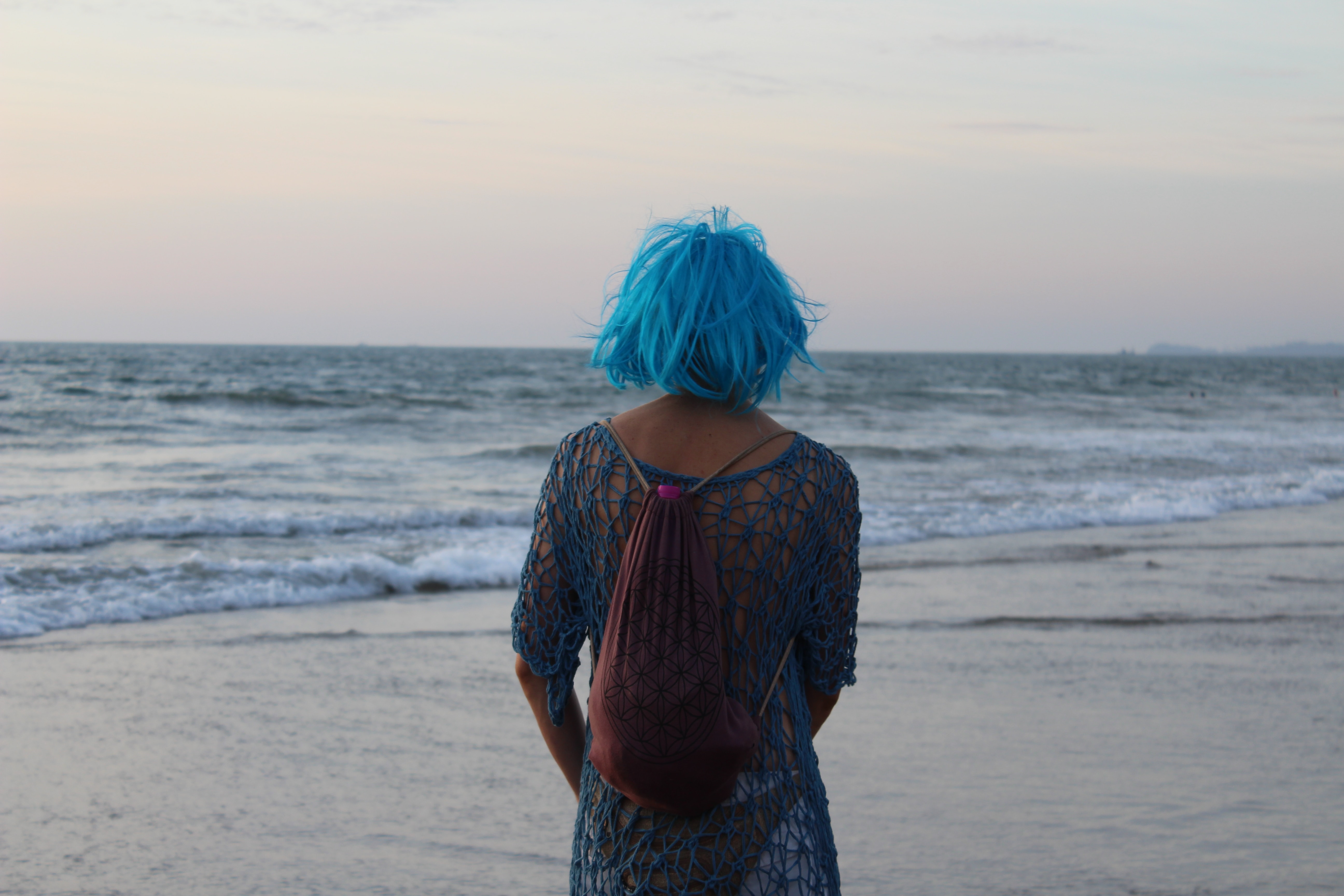 A woman standing on the beach. | Source: Unsplash