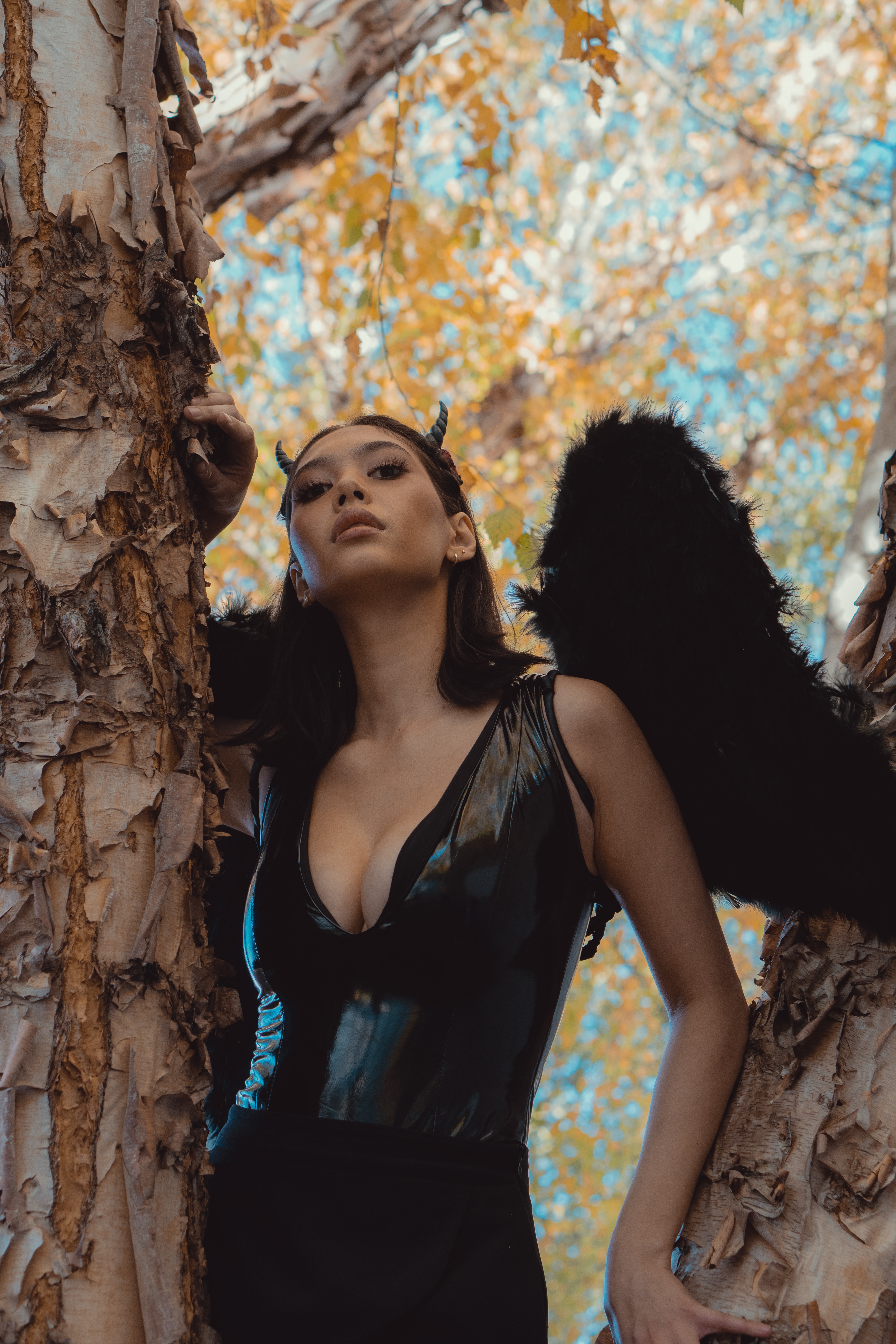 A woman dressed in a black angel outfit. | Source: Pexels